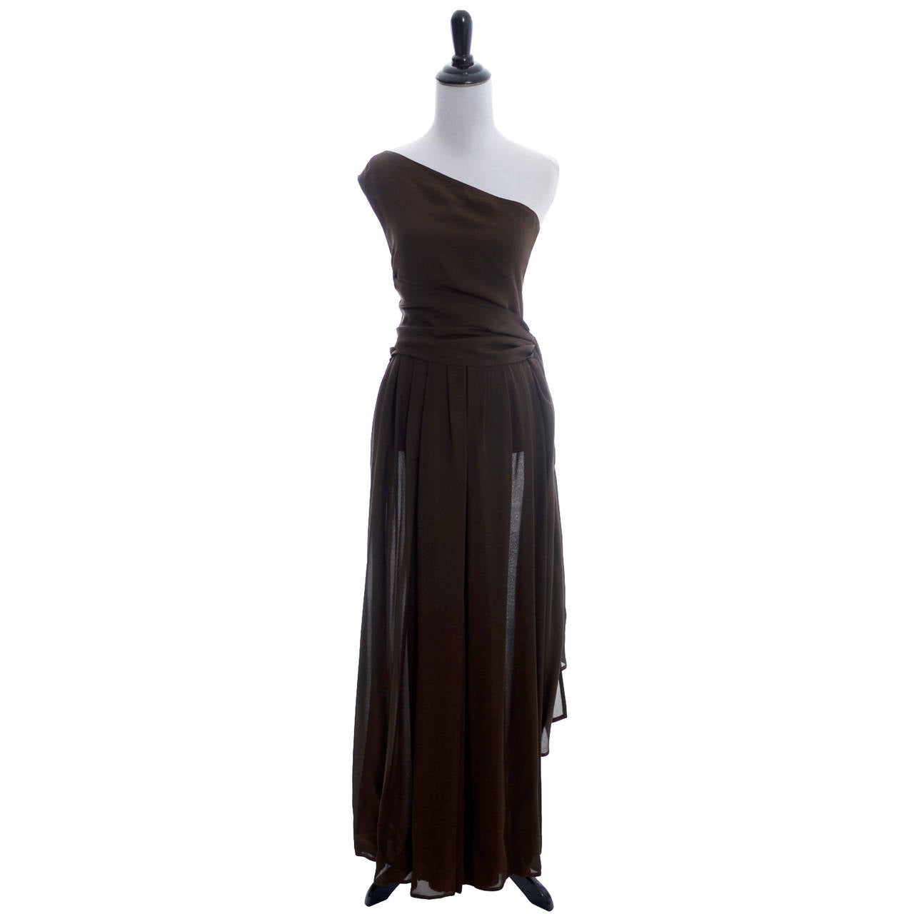 This Michael Kors 2 piece chocolate brown silk evening ensemble is phenomenal! The asymmetrical one shoulder top ties around the waistband of the palazzo pants, giving the appearance of an elegant evening gown. The pants close with side snaps and