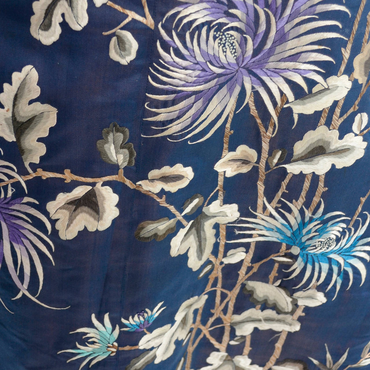 This extraordinary embroidered silk Chinese cheongsam came from an estate I recently acquired of fine Asian silk clothing. The woman collected pieces from the late 1800s through the mid part of the 20th century. This is from the late 1910's and the
