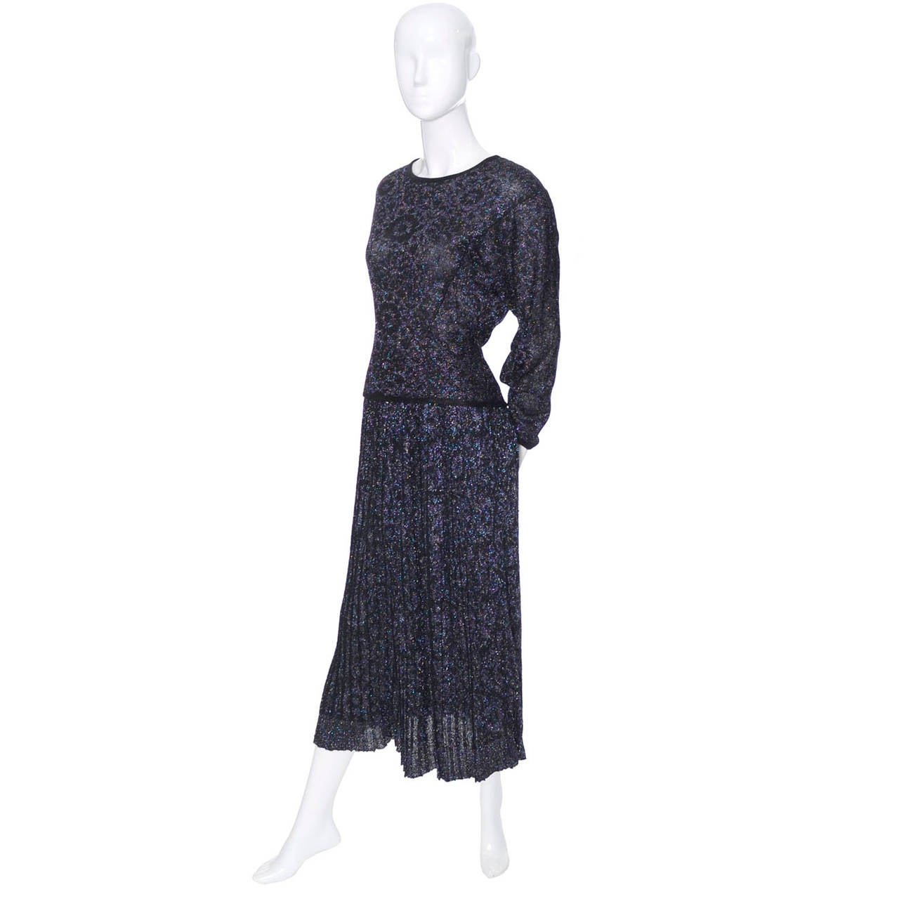 This is a 2 piece vintage Missoni iridescent sparkle outfit with pleated skirt and long sleeved top.  This ensemble was purchased at Saks Fifth Avenue in the 1980's and is labeled an Italian size 44. You can make out a pretty floral pattern in the