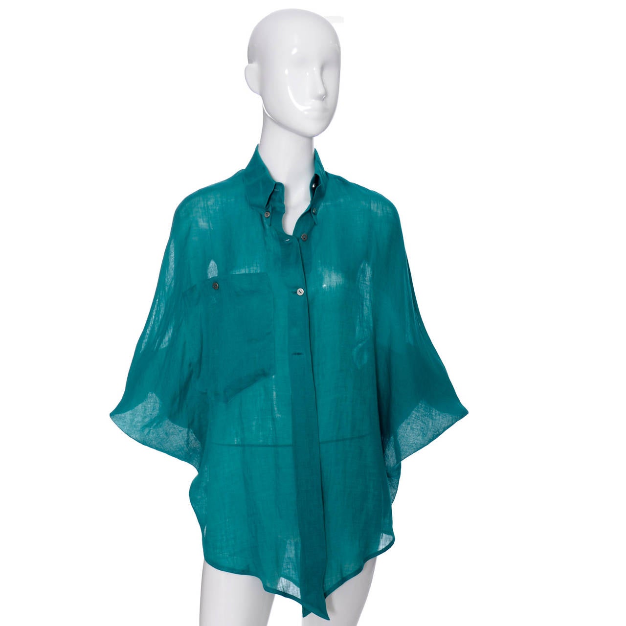 This Claude Montana teal vintage linen shirt was made in Italy in the 1980's. It is in mint condition, most likely never worn, and comes from an estate that had only the finest vintage designer clothing from the 1970's and 1980's.  This blouse