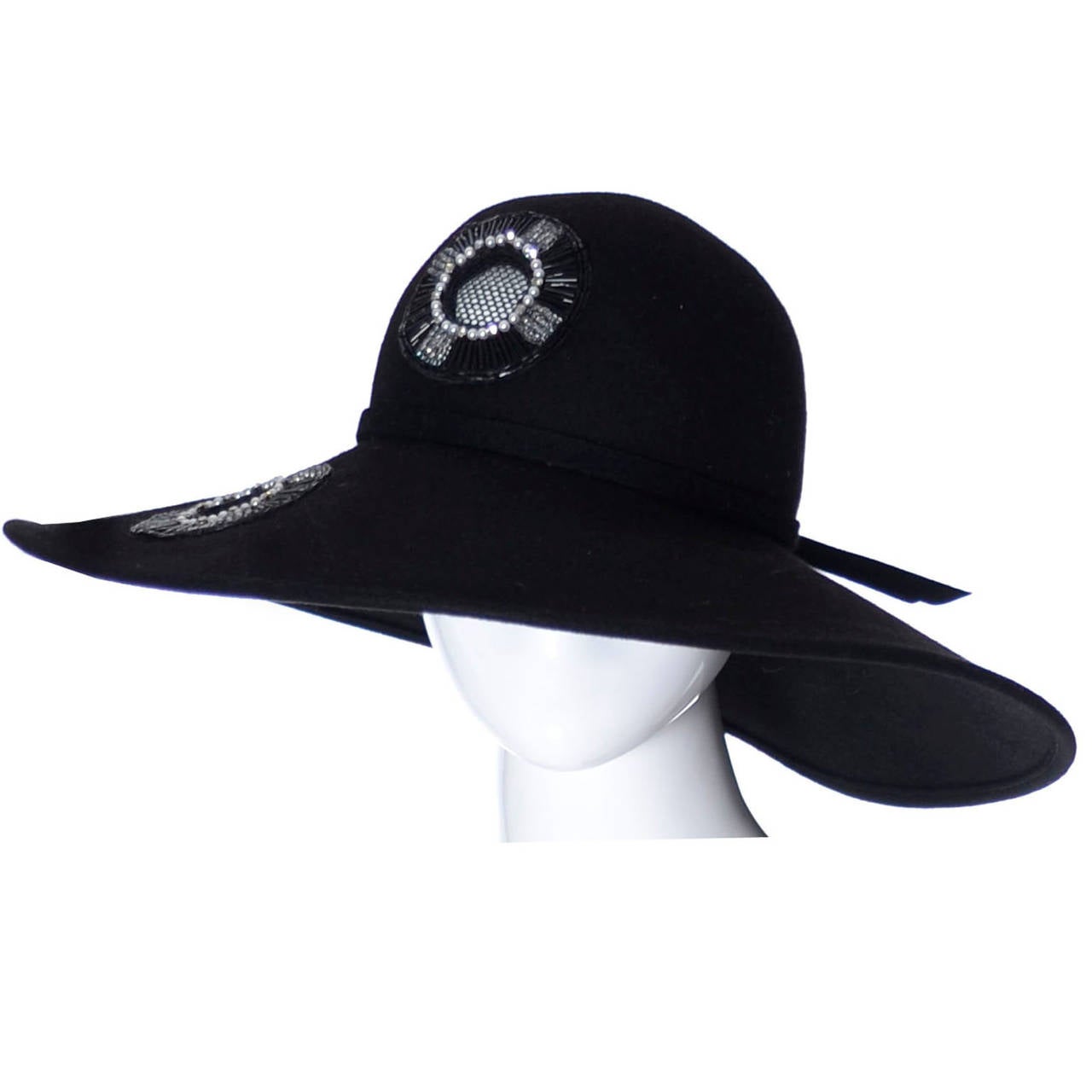 I acquired this Frank Olive vintage hat from an estate that had an amazing collection of designer millinery!  This black felted wool hat has mesh inserts that are embellished with beading, pearls and rhinestones!  This designer hat is in excellent