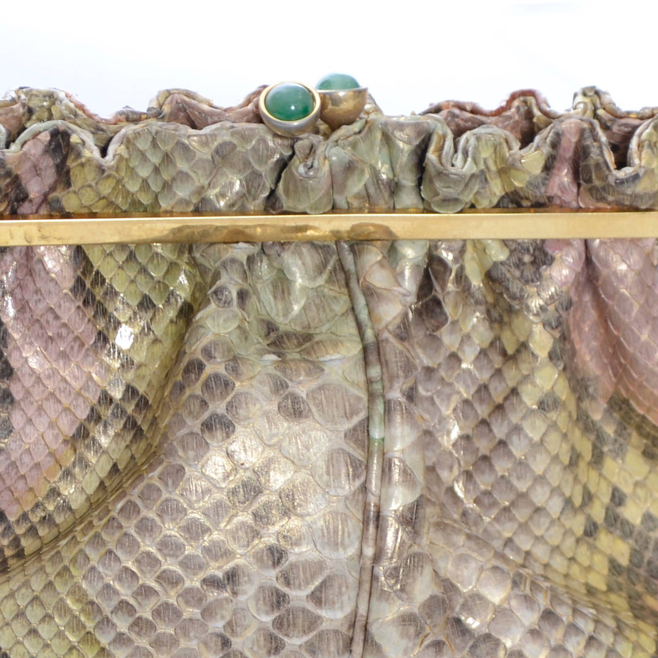 This is an authentic vintage Judith Leiber snake skin handbag that can be worn as a shoulder bag or used as a clutch purse.  The bag is fully lined and comes with its original coin purse and mirror. This handbag measures 10 inches wide, 6 inches