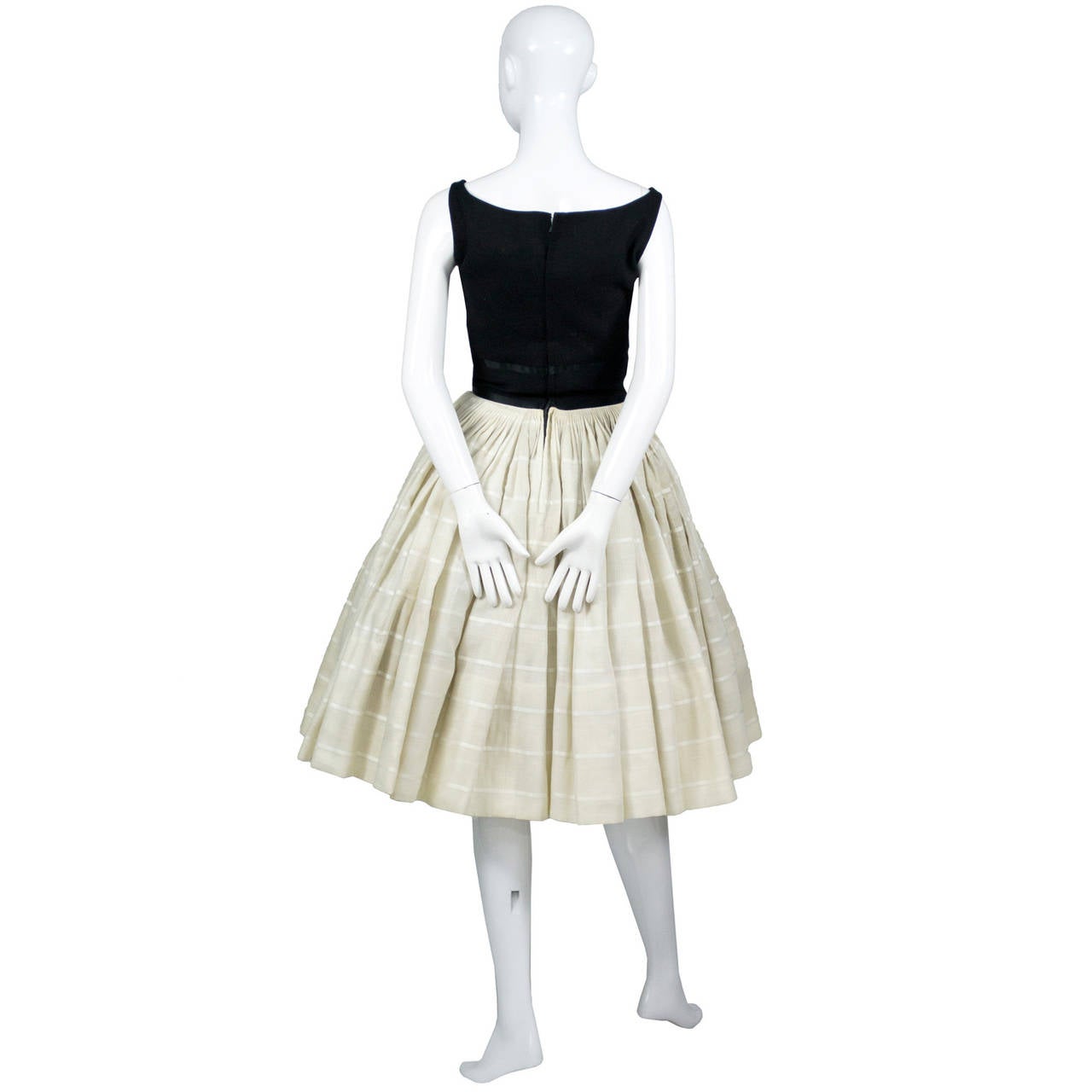 This is a fabulous 1960's James Galanos designer vintage dress with black bodice and natural and white full skirt. This dress was purchased at Woolf Brothers and in excellent condition with no flaws found. The dress appears to have only been worn