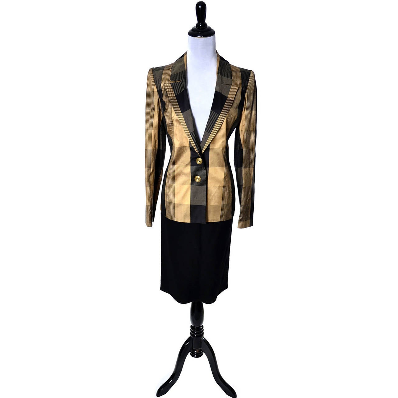This vintage Valentino Boutique Collectible skirt suit ensemble comes with 2 blazer options. This includes a vintage Valentino black boucle wool skirt and both a black boucle wool blazer and a coordinating black and gold plaid silk blazer. You can