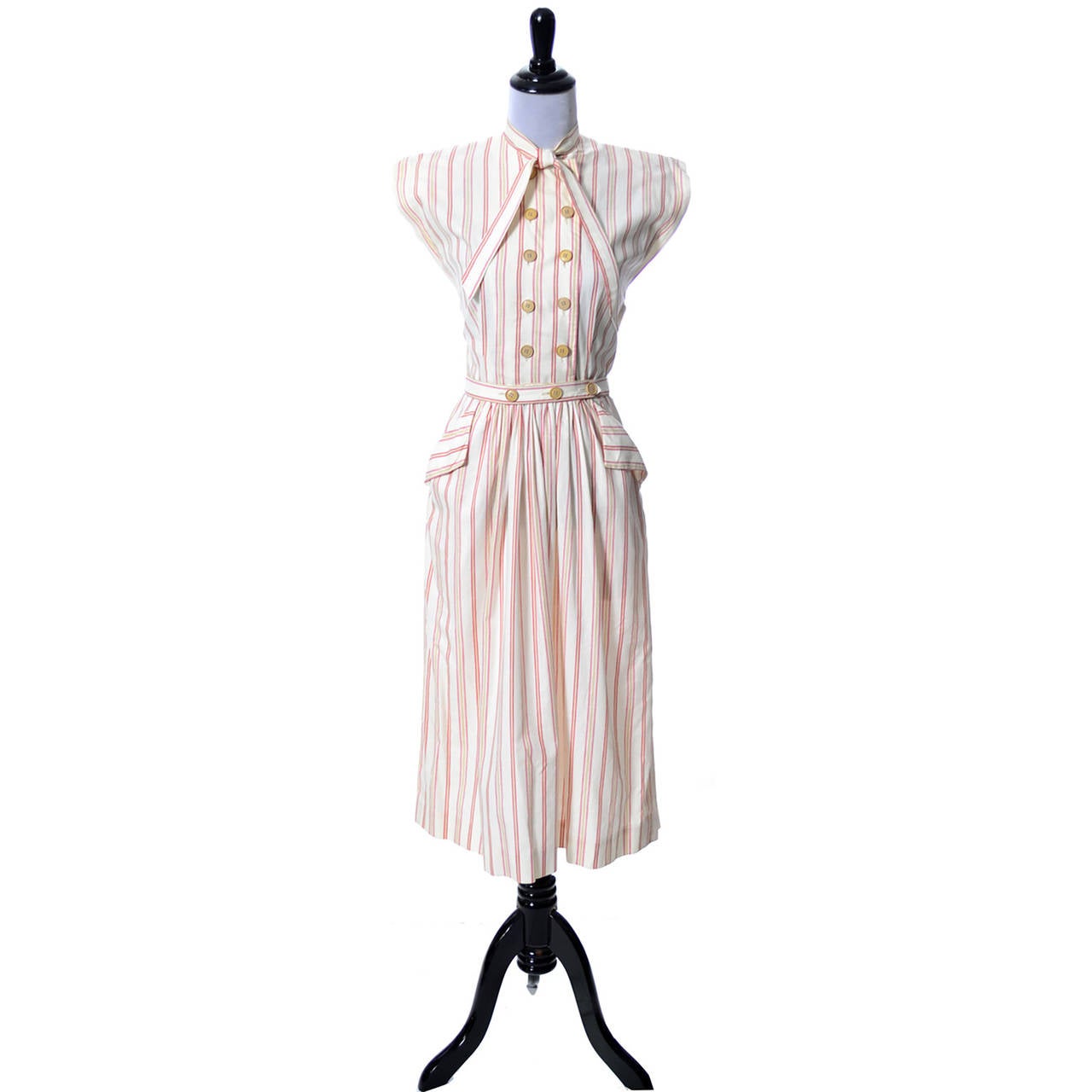 This Claire McCardell vintage dress is from the 1940s and came from one of the finest estates of vintage mid century designer clothing I've ever had the privilege of handling.  The dress is made of a red striped cotton and has a double breasted