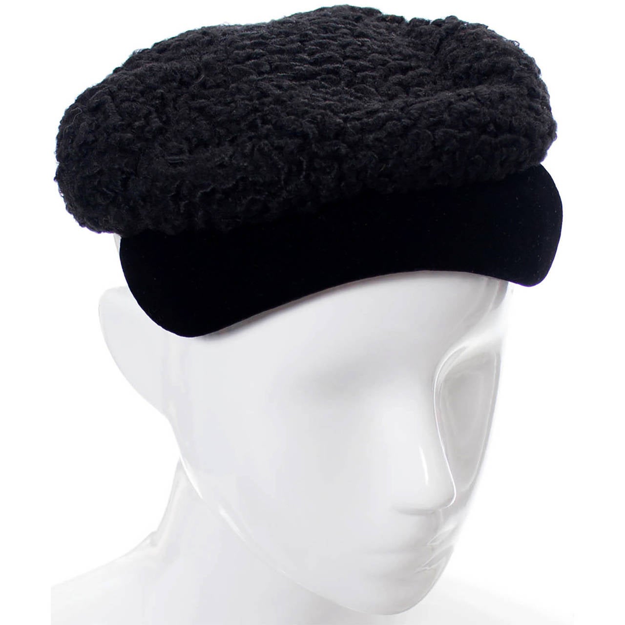 If you collect vintage hats or specifically love the designer Hattie Carnegie, you will adore this little curly lambswool vintage cap with black velvet brim! From a prominent estate, you'll find it in excellent condition! This vintage hat measures