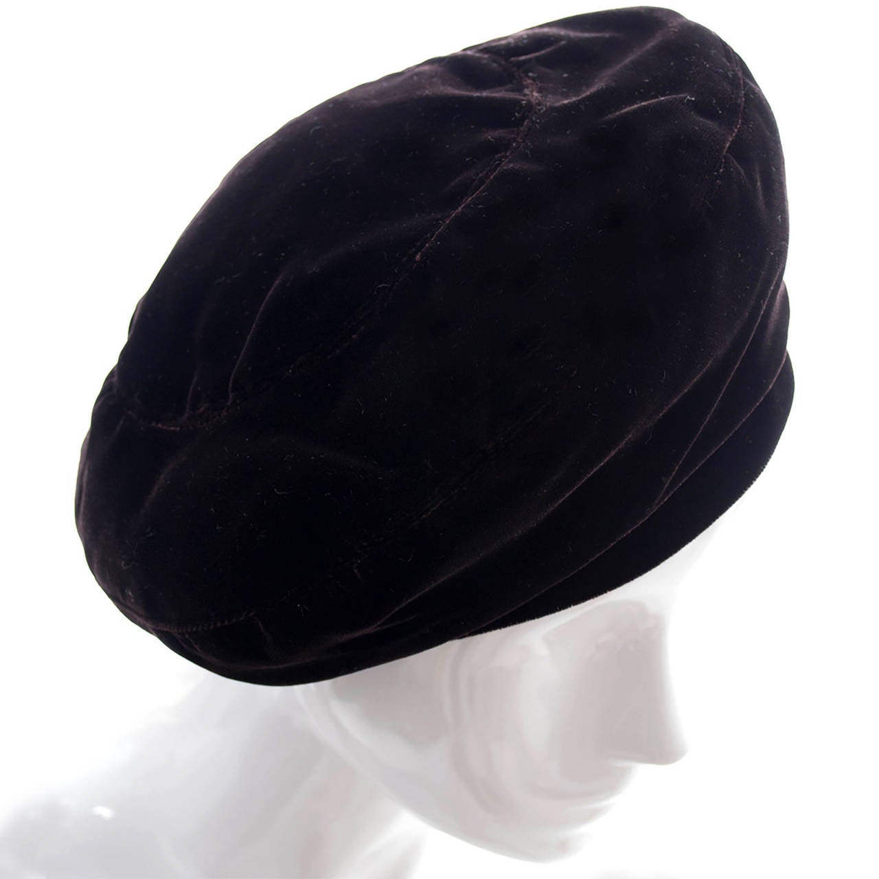 This vintage YSL hat is in a rich, luxurious chocolate brown velvet.  A beautiful 1970's beret from an estate of outstanding vintage clothing and accessories. The hat measures 21 and 1/2 inches in circumference and has the Yves Saint Laurent Rive