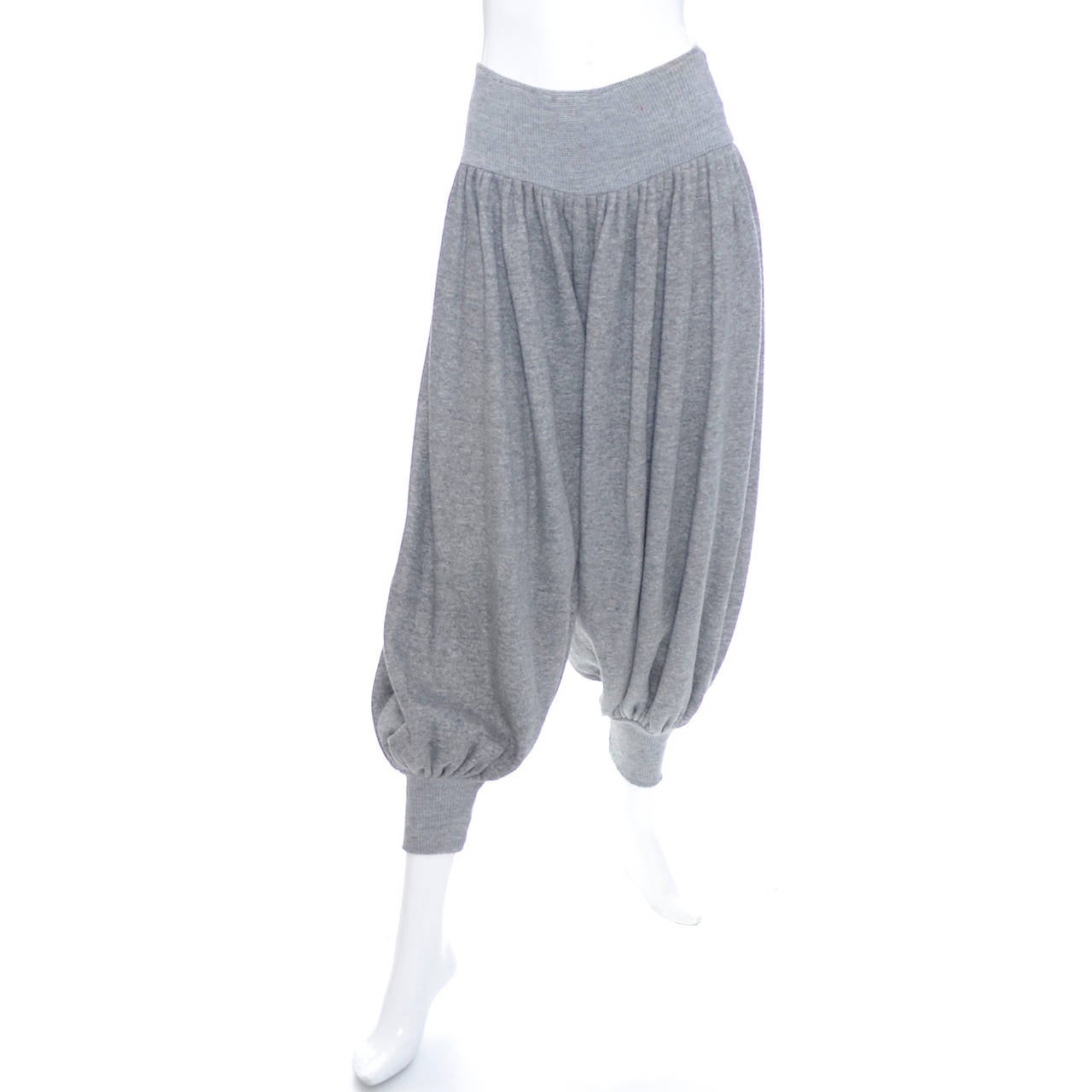 These vintage Norma Kamali sweatsuit inspired gray knicker harem pants are from 1981. They are gray cotton with soft fleece on the reverse side. These became an important signature piece for Norma Kamali.  They were part of a collection that was