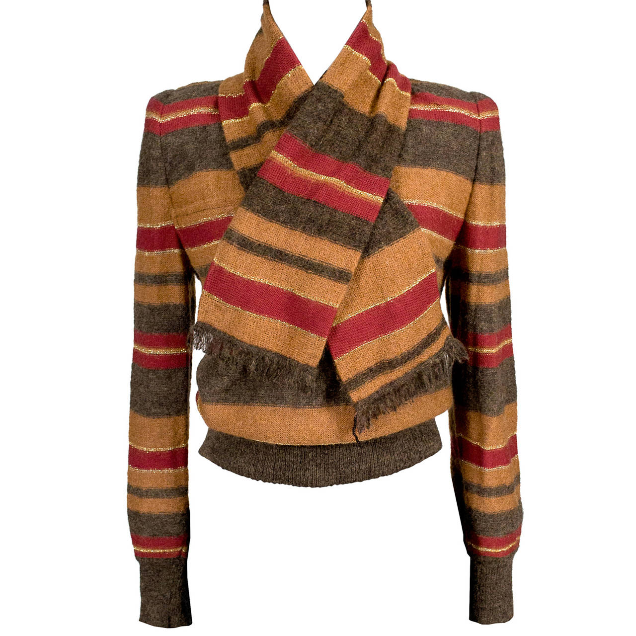 This is a beautiful vintage wool Valentino sweater with pretty velvet covered buttons and a velvet collar. Made in Italy in the late 1970s or early 1980s, this sweater has shoulder pads, a single front pocket, and a brown velvet collar that can be