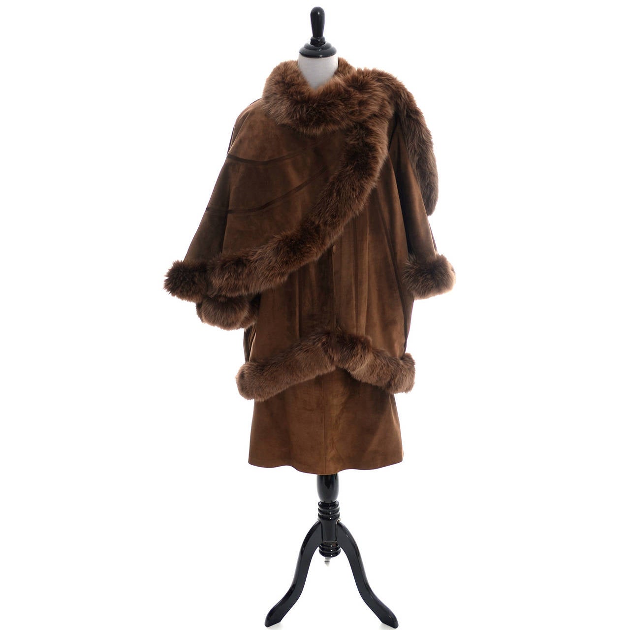 This is an absolutely outstanding 2 piece skirt and coat suit ensemble from Beltrami that was made in Italy in the 1980's.  The suede coat has an attached cape and buttons up the front. This suit comes from the estate of a woman who lived in Sweden,