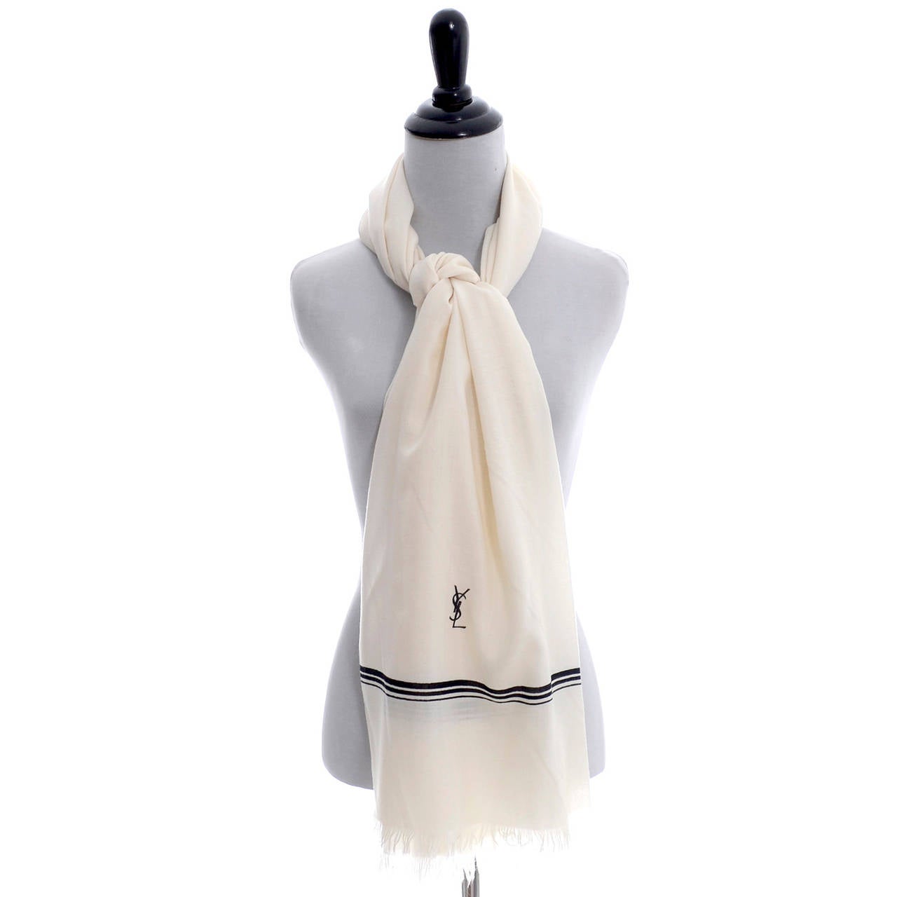 This gorgeous YSL logo scarf measures 36 by 64