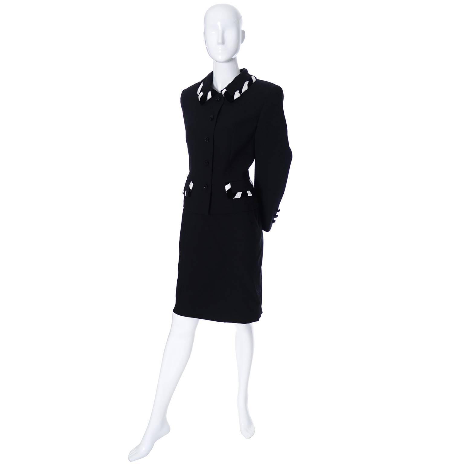 This is a really nice vintage Escada couture 2 piece skirt and jacket suit from the  1990s.  The blazer has pretty white satin and black velvet wide ribbons woven in the collar and flaps of the pockets.  There are lovely black glass buttons and both