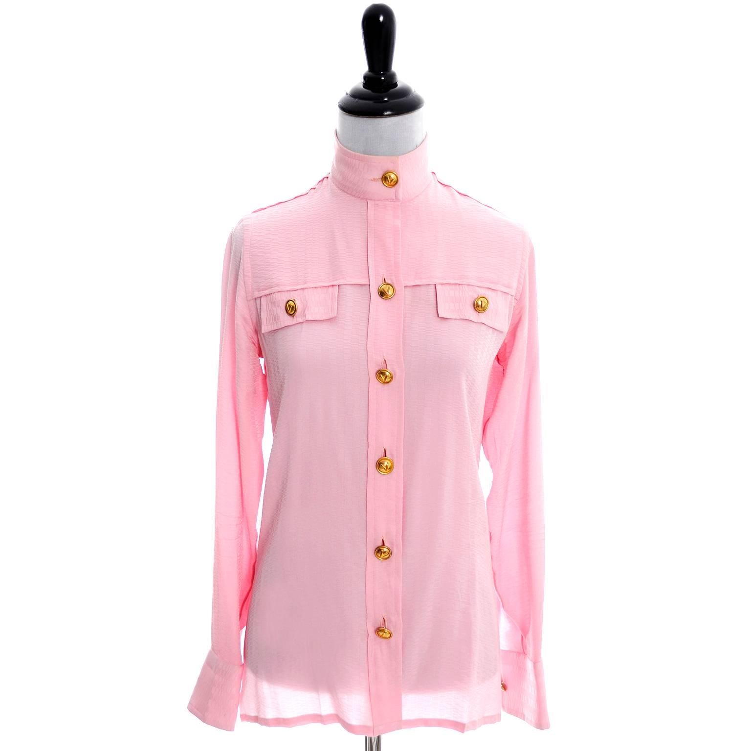 This is a simply divine tonal patterned pink silk vintage blouse from Valentino. This rare 70's Valentino pussy bow blouse is one that we have hesitated to sell because it is one of our favorites. You can wear this top with the pretty sash tied in a