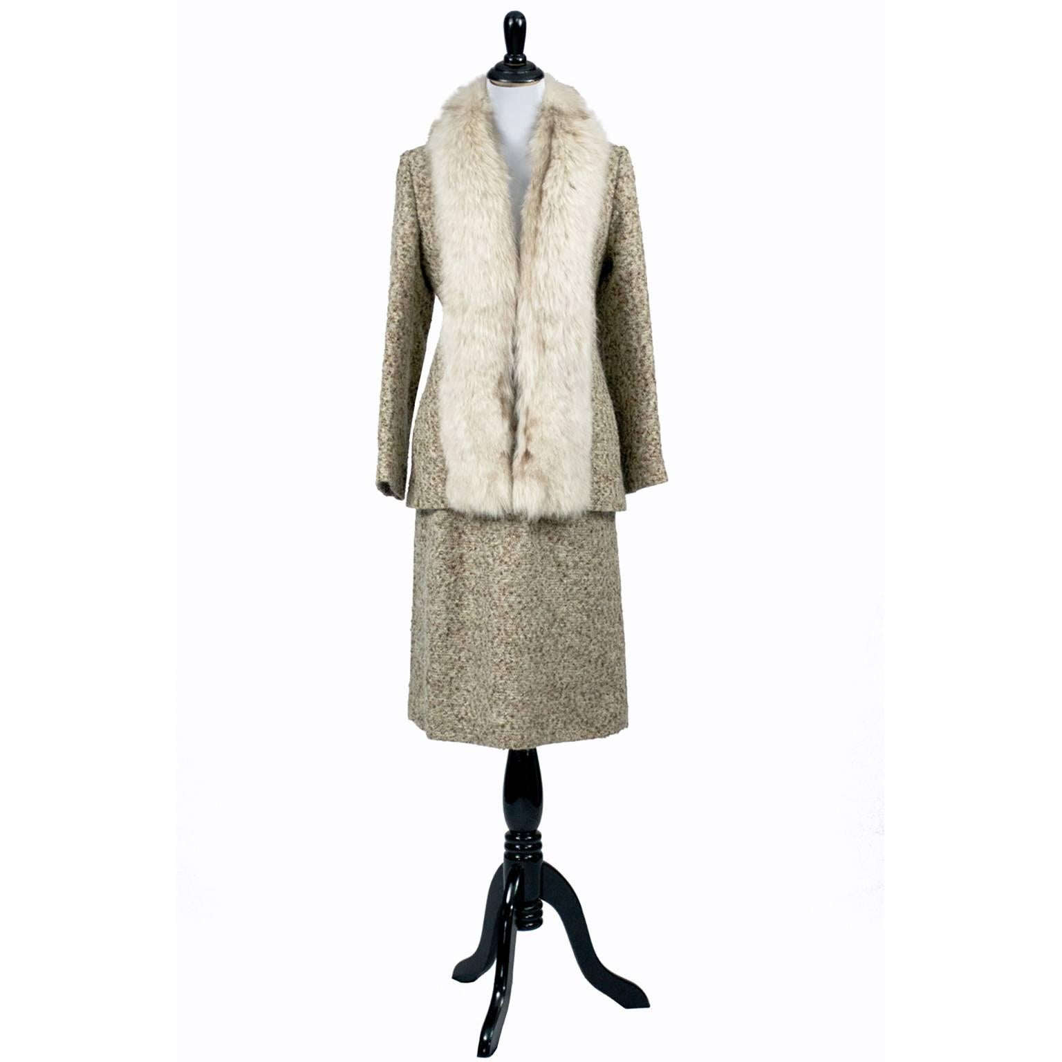 This is a vintage Adolph Schuman for Lilli Ann fox fur trimmed wool tweed 2 piece skirt suit.  This label indicates that this garment is from the late 1960’s or early 1970's.  Adolph Schuman was the person who started Lilli Ann and the company was
