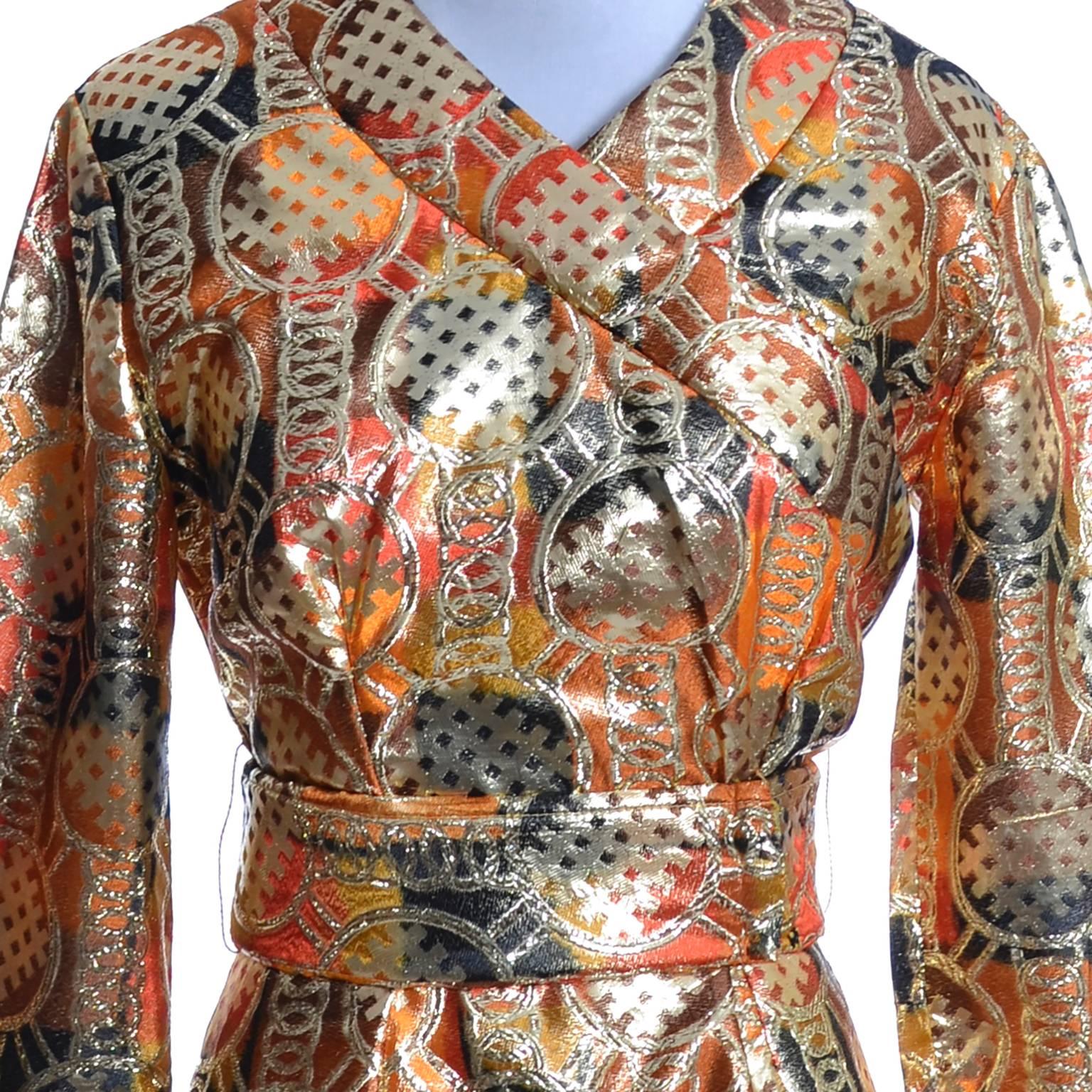 This is an amazing vintage late 1960's or early 1970's Krist of California gold lame mod kimono style maxi dress. This orange, black, brown and gold metallic sparkle formal vintage dress is in as new condition and has a back zipper, a slit up the