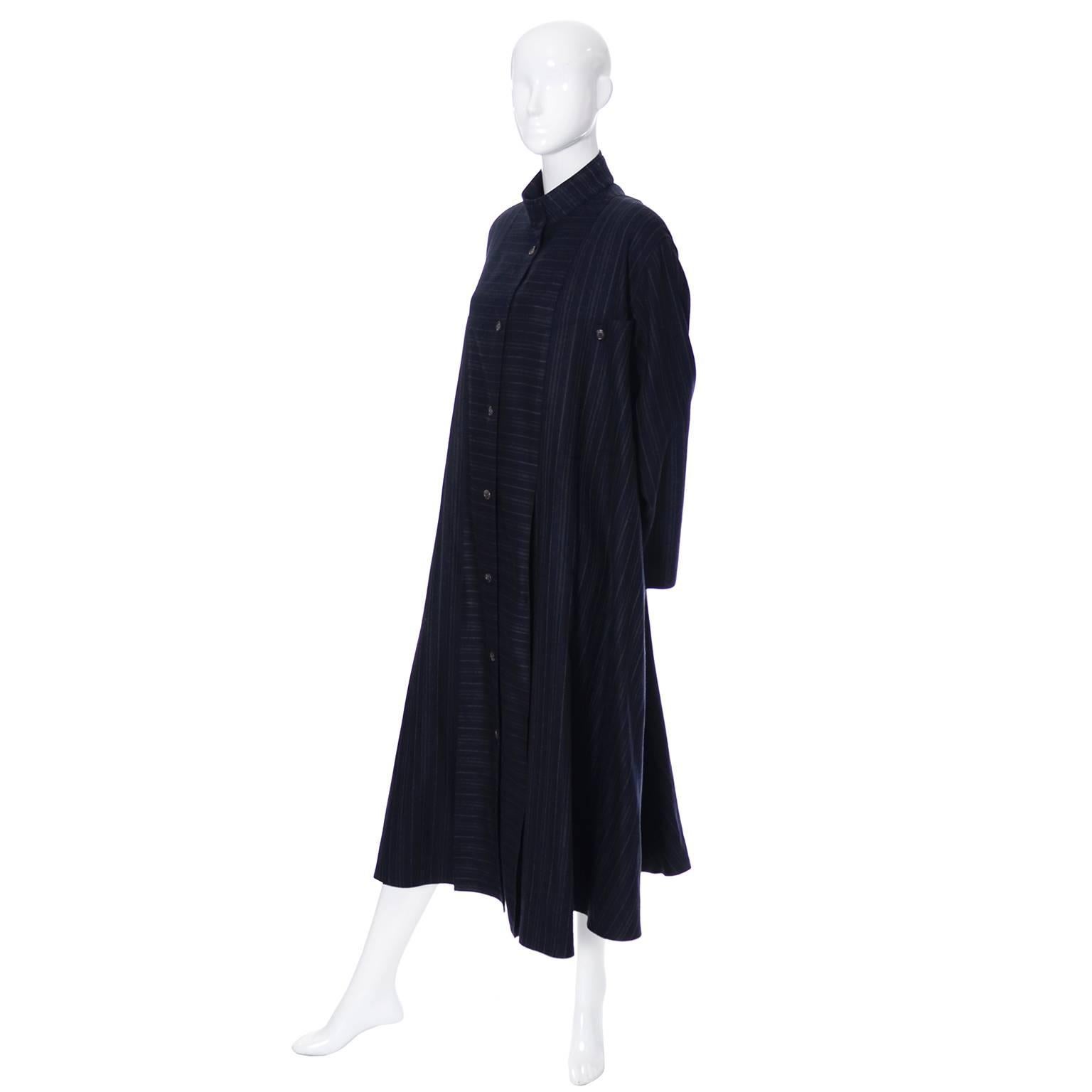 This is a fabulous vintage coat from Harve Benard designed by Benard Holtzman from the 1980's. This versatile swing style coat is made from a beautiful midnight navy blue wool with micro pin striping.  The woman who owned this coat owned many pieces