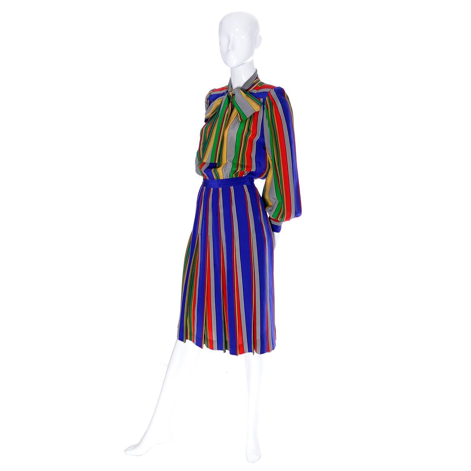This beautiful vintage dress is from the Yves Saint Laurent Rive Gauche collection from the late 1970's. The dress is in a fabulous multi colored silk striped fabric and the top portion has a pretty sash or bow.  The dress looks like two pieces but