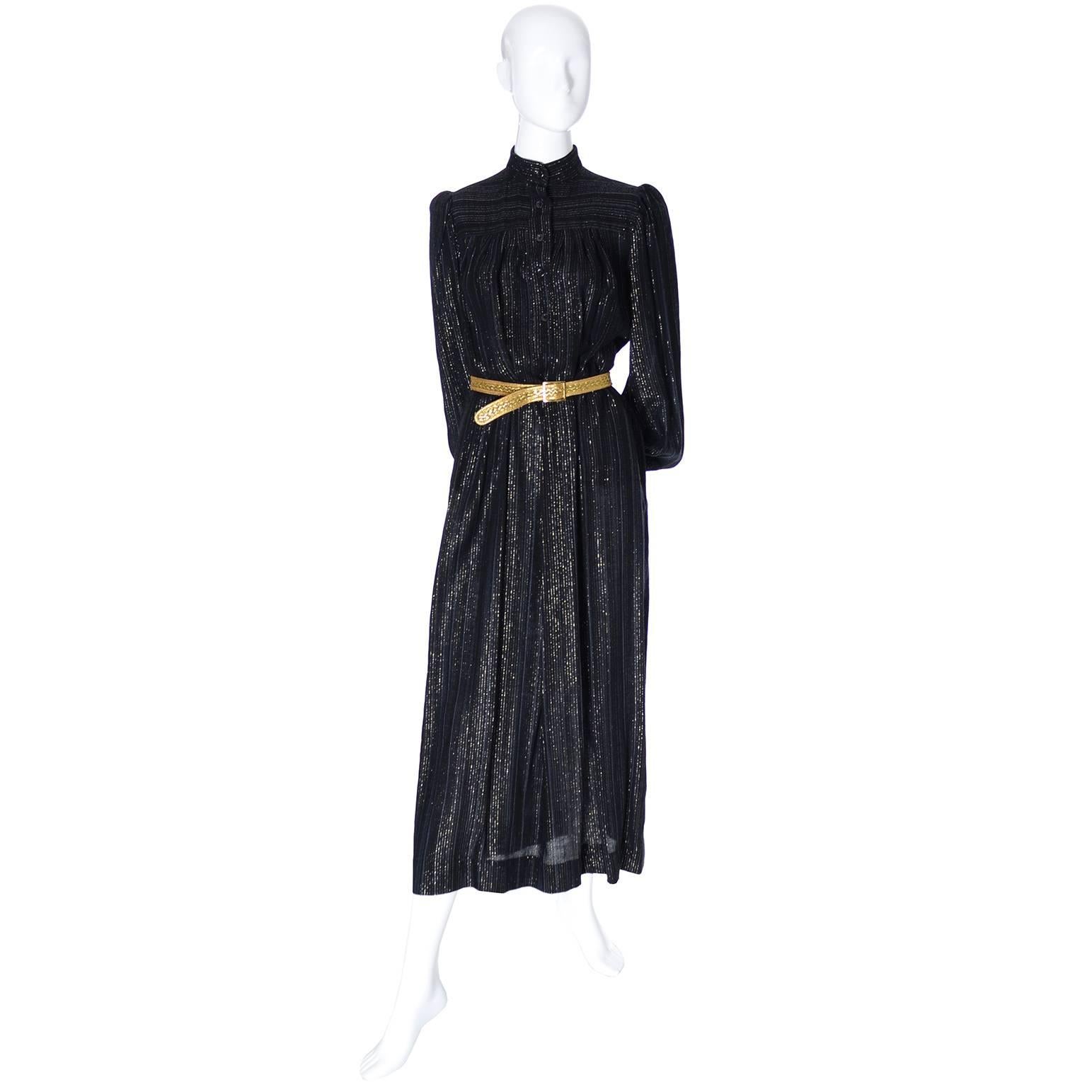 This is a fabulous vintage YSL dress in black and gold metallic fabric with buttons up the front of the bodice and a mandarin collar. The dress has long bishop sleeves and comes with the belt that was with it when I acquired it, though the belt