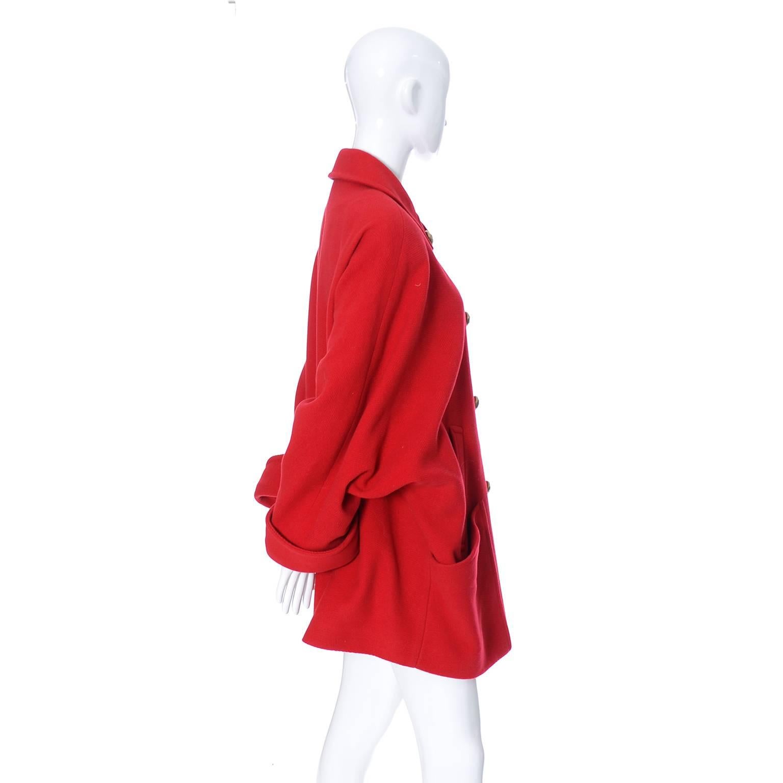 We love this coat! A 1980's vintage red wool Guy Laroche Boutique coat with giant brass buttons and front pockets. The coat is fully lined in beautiful red satin and the 80's iconic dolman sleeves are so fabulous - hard to show on my mannequin! This