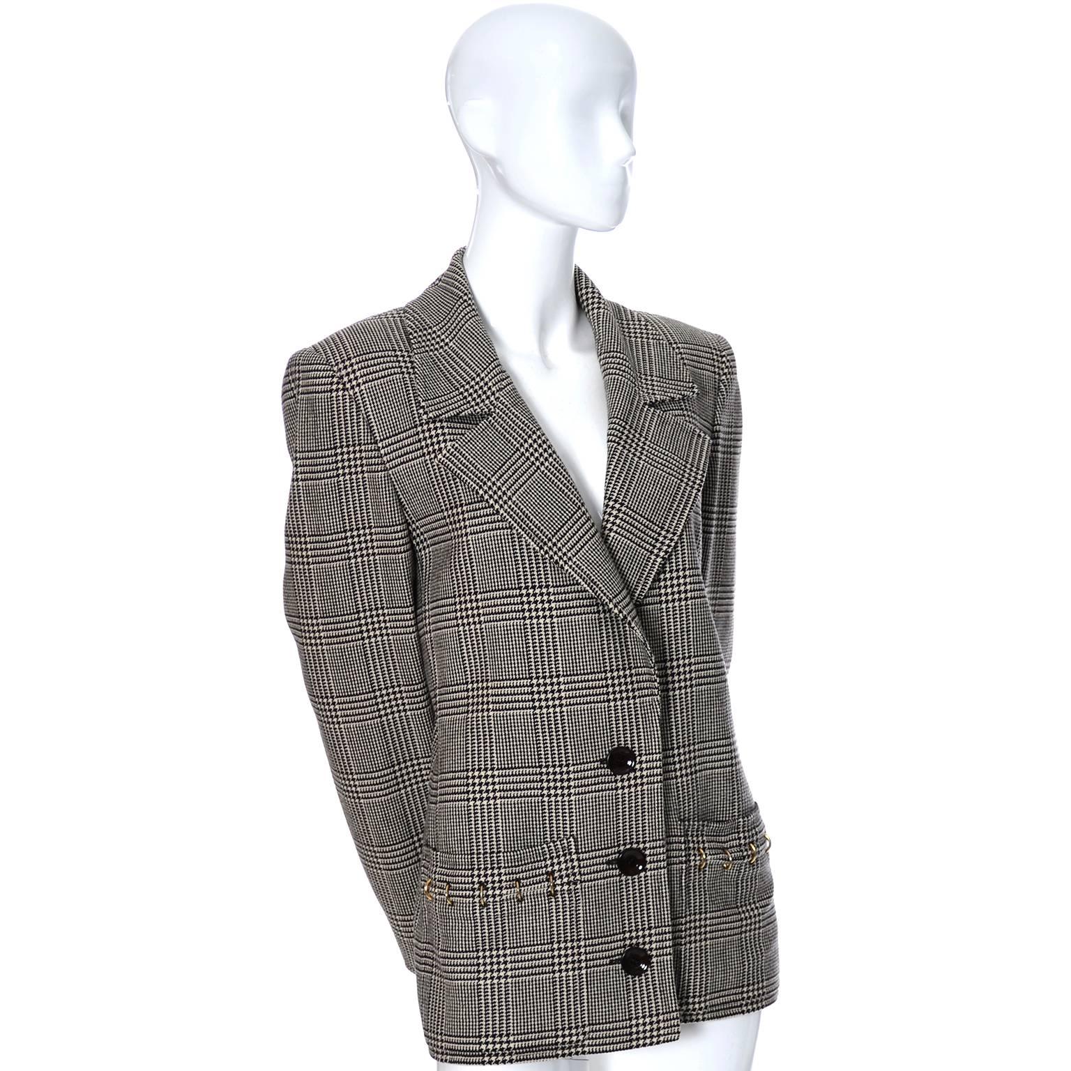 This is a vintage Valentino Boutique blazer fab metal rings on the pockets and the cuffs of the sleeves. The jacket is fully lined and made in a plaid black and ivory wool.  Please use the measurements as a guide for the best fit, but I would