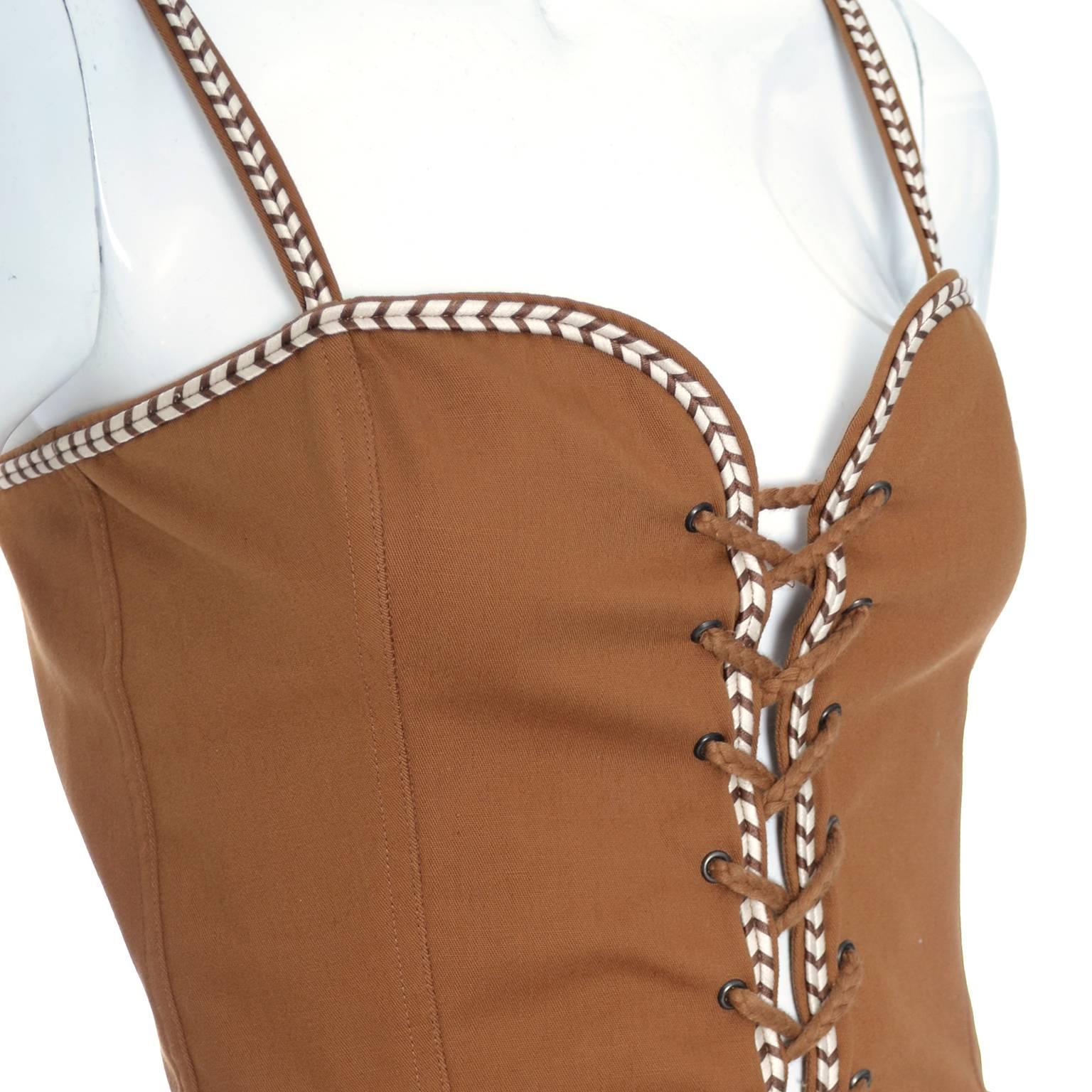 This is a fabulous vintage Yves Saint Laurent copper cotton bustier with laces up the front and wonderful trim. This vintage YSL top was made in France in the late 1970's and is in excellent condition.  This corset style top is labeled a size 38 but