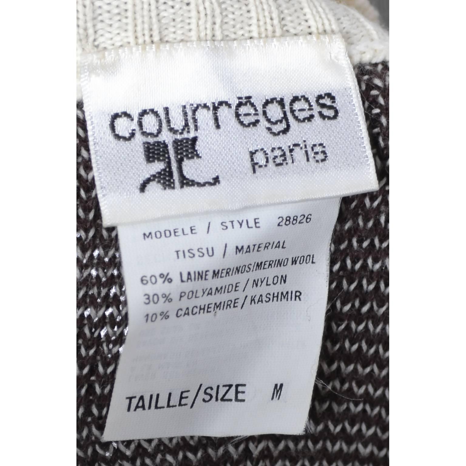 This is a great vintage brown and cream knit Courreges sweater in a 60% wool, 30% nylon and 10% cashmere blend.  This Courreges vintage sweater has contrasting cuffs and collar and a great snowflake on the front!  This sweater is labeled a size