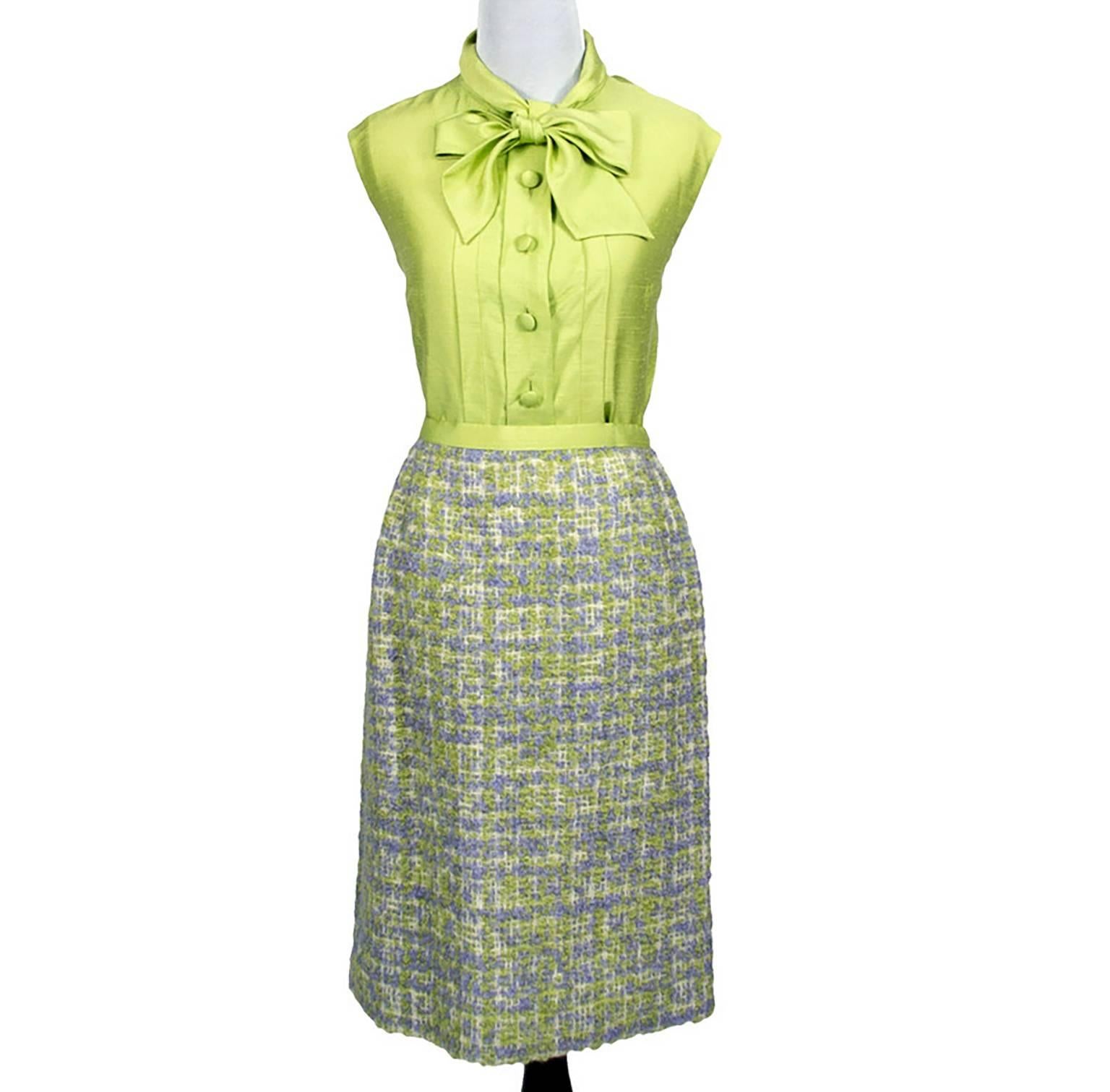 The perfect vintage skirt suit! This is a gorgeous, very refined, couture quality 3 piece vintage skirt suit from Geneva, Switzerland in lime green and purple wool boucle tweed with a raw lime green silk blouse. This ensemble was purchased in the