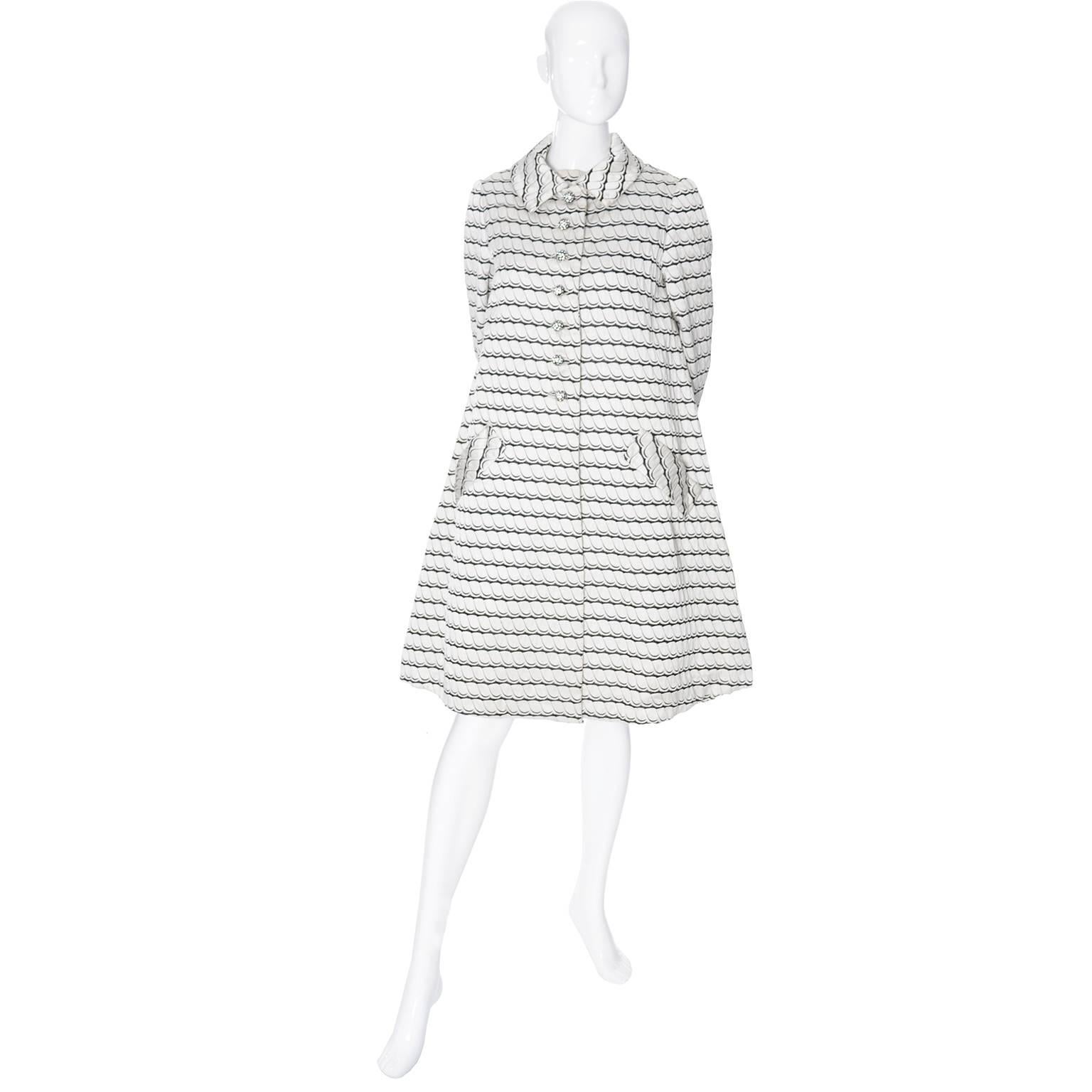 This is a pretty vintage 1960's ensemble from Sara Fredericks.  Sara Fredericks was a prominent boutique with several locations that catered to women who wore only the best!  The suit includes a sleeveless shift dress and a pretty swing coat with