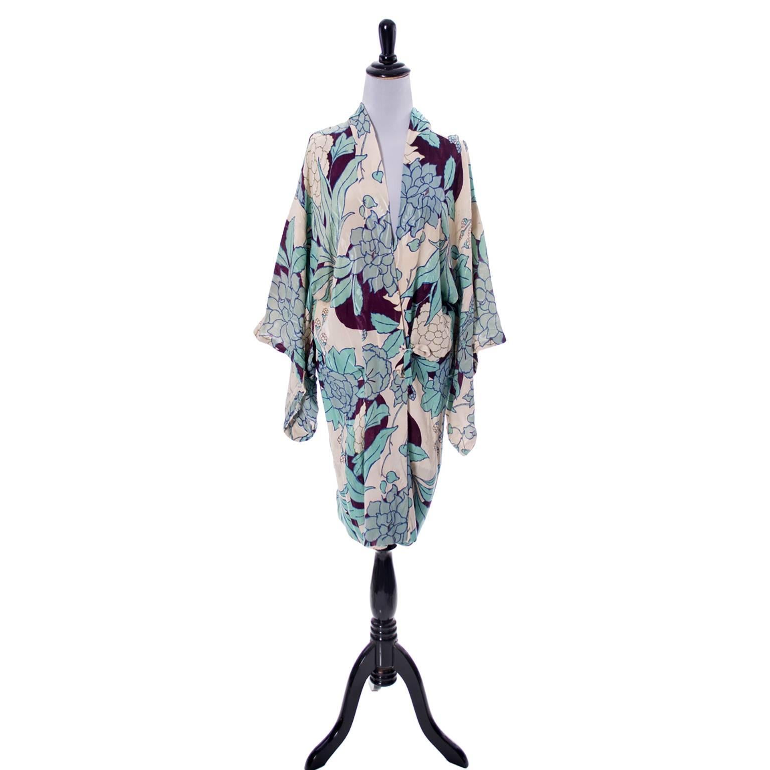 This is a really beautiful late 1920s or early 1930s Japanese fine silk vintage Kimono floral robe with self ties. The floral pattern is gorgeous in shades of blue and deep eggplant.  This measures  37