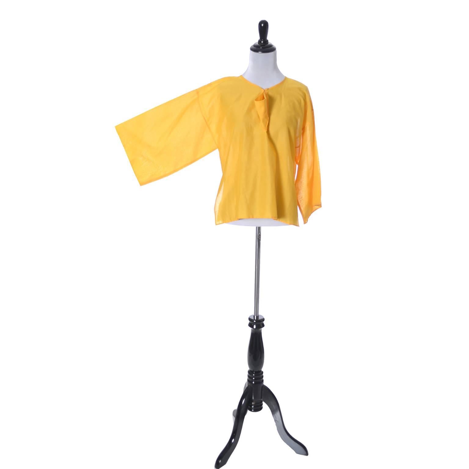This vintage 1970's citrus yellow orange cotton boxy top has fabulous kimono style sleeves and was designed by Jean Charles de Castelbajac for Ko and Co.  This beautifully designed vintage blouse is in excellent condition and was purchased at Henri