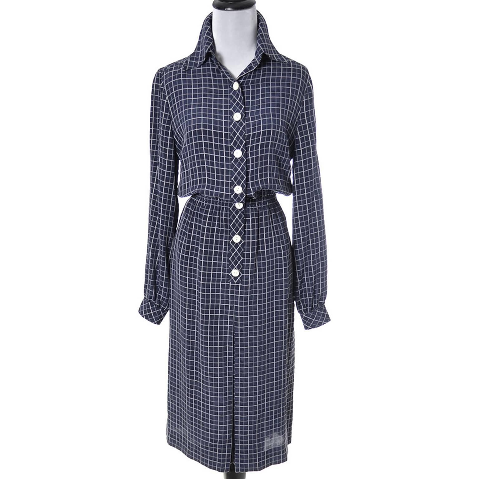 This is a wonderful 1970's vintage dress from Loewe - the Madrid, Spain high end fashion brand.  This navy blue and white vintage dress comes with a matching logo scarf and a navy blue half slip to wear underneath.  The fabric feels like a