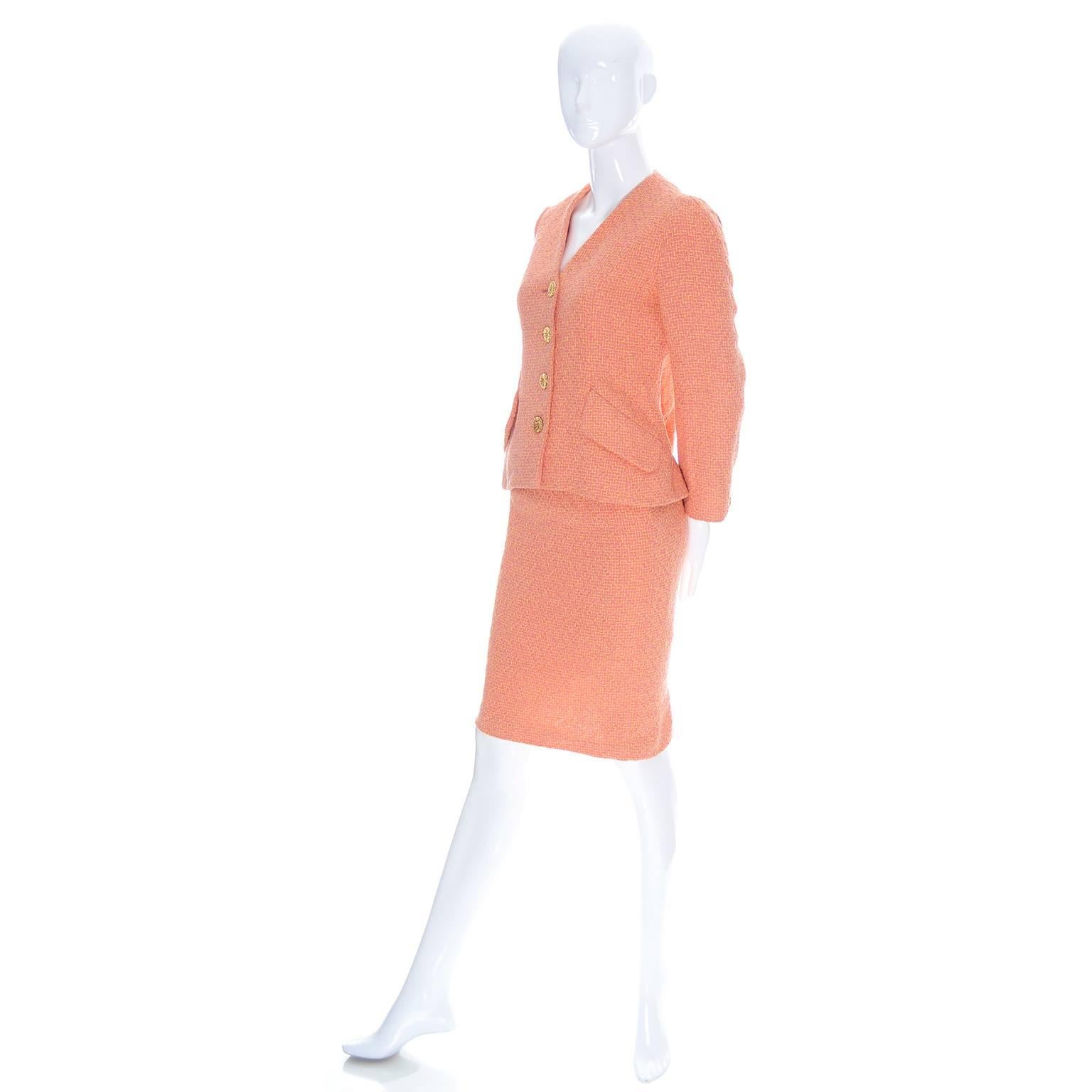 This beautiful designer vintage suit is from Guy Laroche and was made in France.  The suit is in a beautiful Orange, salmon pink, and yellow fine tweed like fabric and is fully lined in the same salmon pink as is in the fabric.  This suit belonged