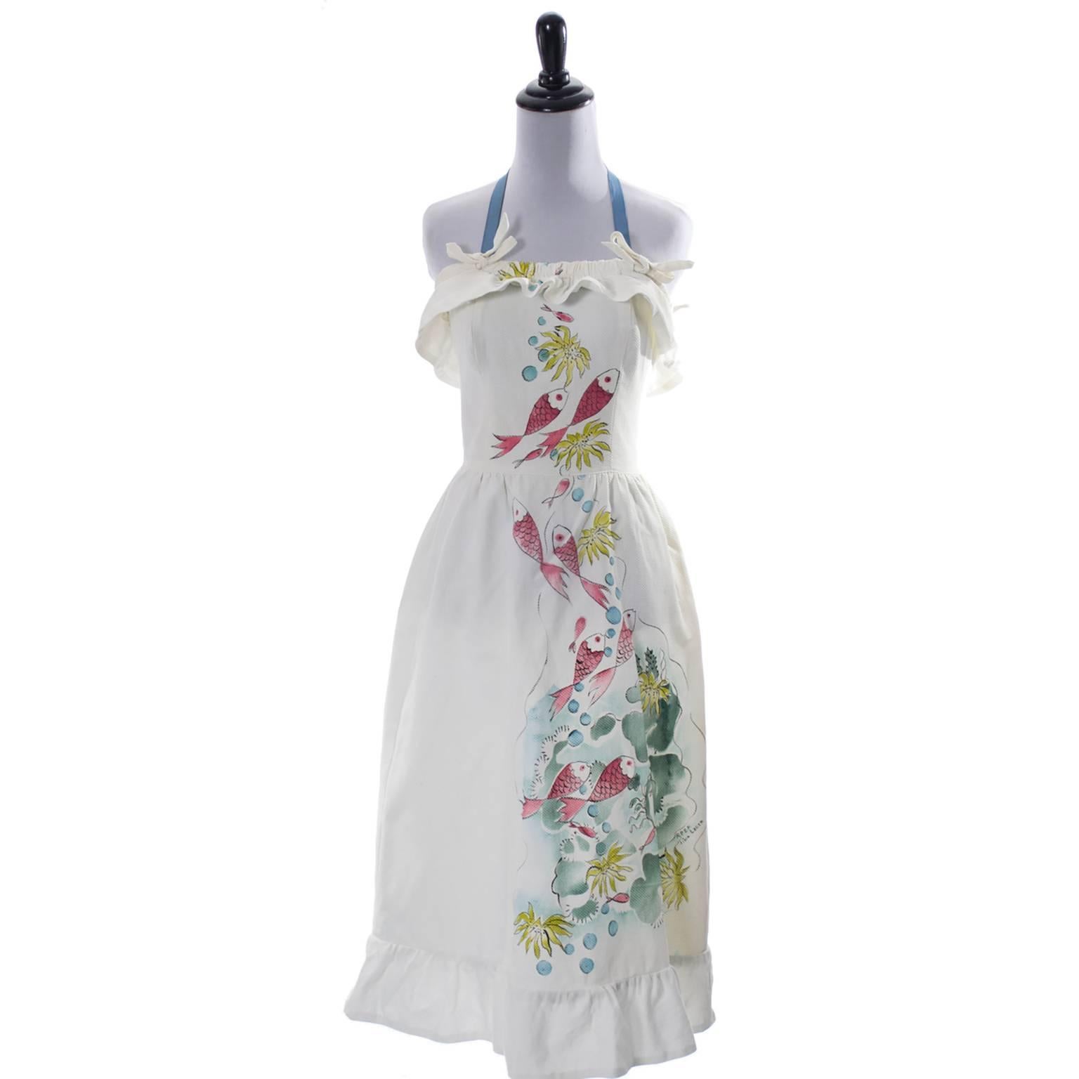 This is a very rare cotton pique 1940s vintage dress that was hand painted by designer Tina Leser.  Very rare and very hard to find, the hand painted Tina Leser garments are found in museums.   Tina Leser was inspired by the fabrics and natural