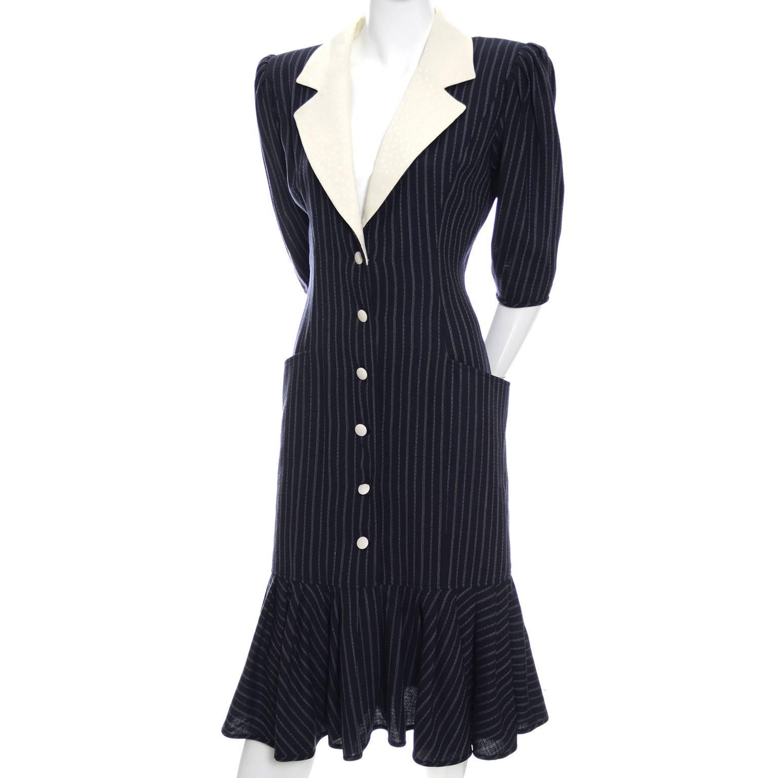 This vintage Ungaro dress is in as new condition and comes from the estate of some of the finest vintage designer clothing I've ever had the privilege of handling.  This navy blue pinstriped fine wool crepe dress is lined and has a tone on tone