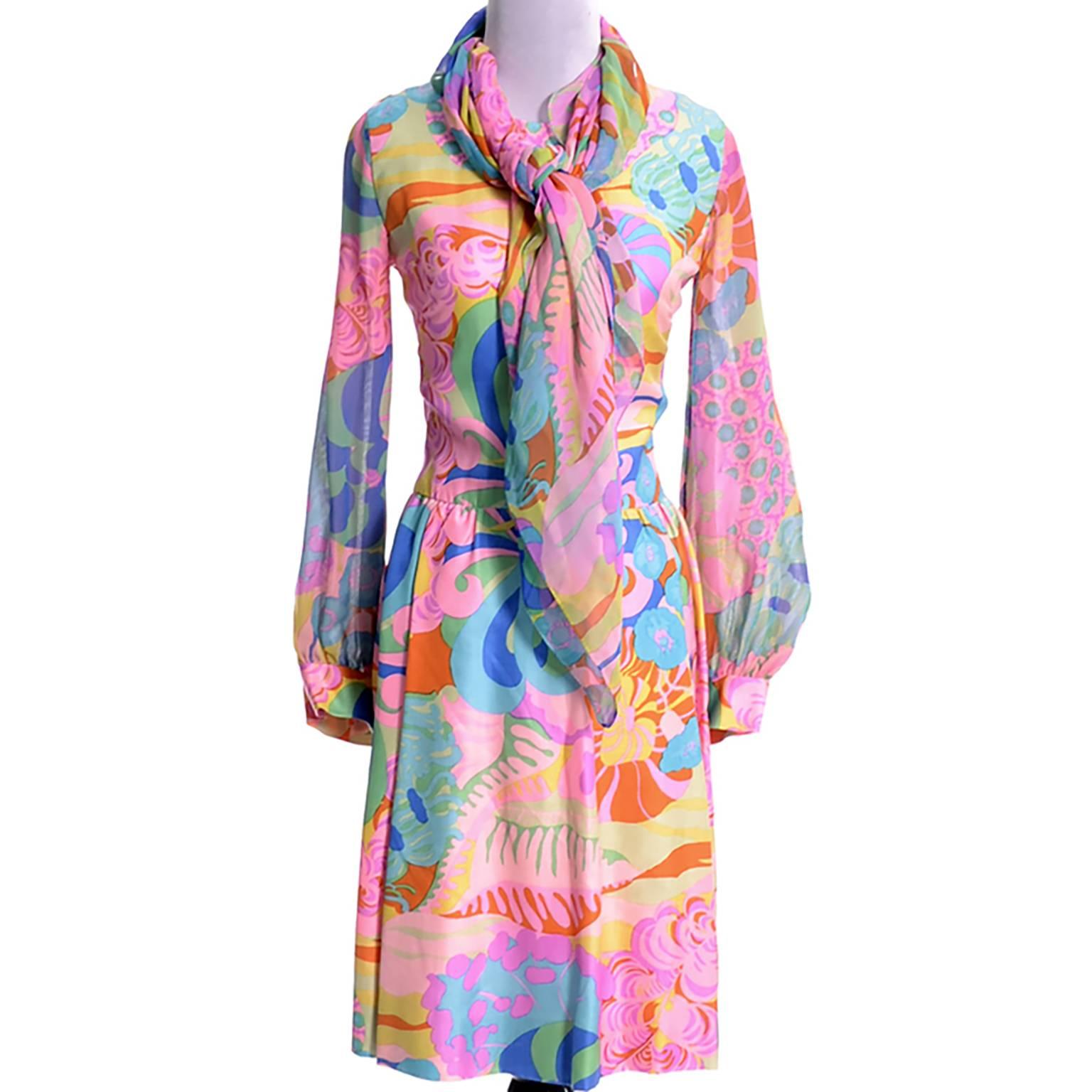I love this rare vintage silk 1960's Psychedelic MOD dress from designer Tina Leser. The dress comes with a matching silk chiffon scarf and the ensemble is in incredible condition - appears unworn.  The scarf can be worn in dozens of different ways,