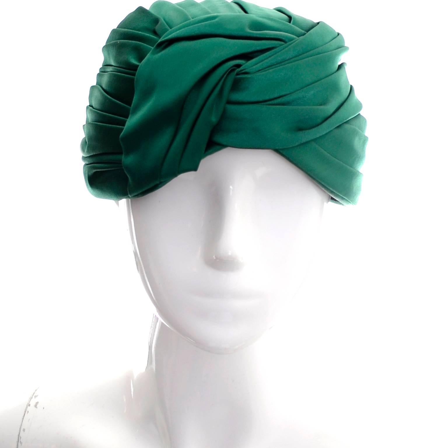 This lovely vintage hat was created in the 1960's but it is in as new condition.  The beautiful green satin is perfectly pleated and the hat almost resembles a turban when worn.  This hat has the Miss Dior Created by Christian Dior label and is