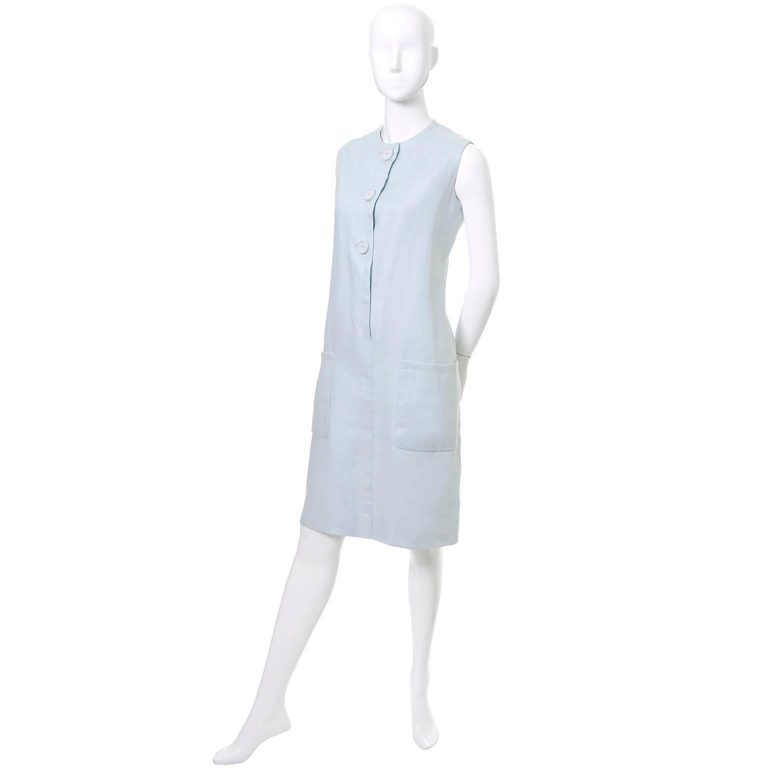 This late 1960's vintage Norman Norell dress buttons up the front and has front pockets. This light blue linen vintage dress is sleeveless and fully lined and is in excellent condition. I would estimate the dress to be a modern day size 8/10, but