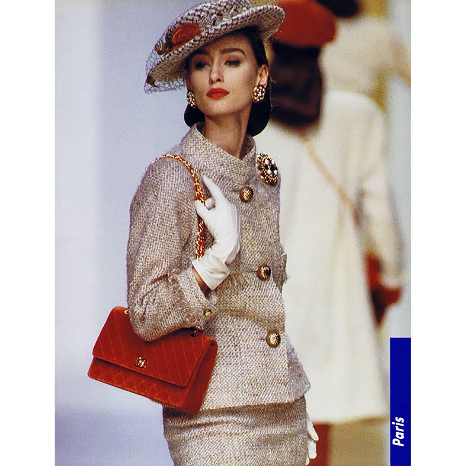 This vintage Chanel suit was designed by Karl Lagerfeld and it is from the Fall Winter 1988 collection.  We are showing the photo of it being modeled by Aly Dunne.  This suit came from an estate that had many vintage Chanel pieces.  Both the skirt