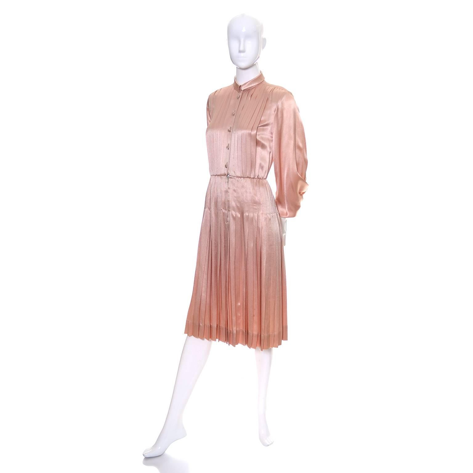 This luxurious satin dress was designed by Albert Nipon in the 1970's.  Press 