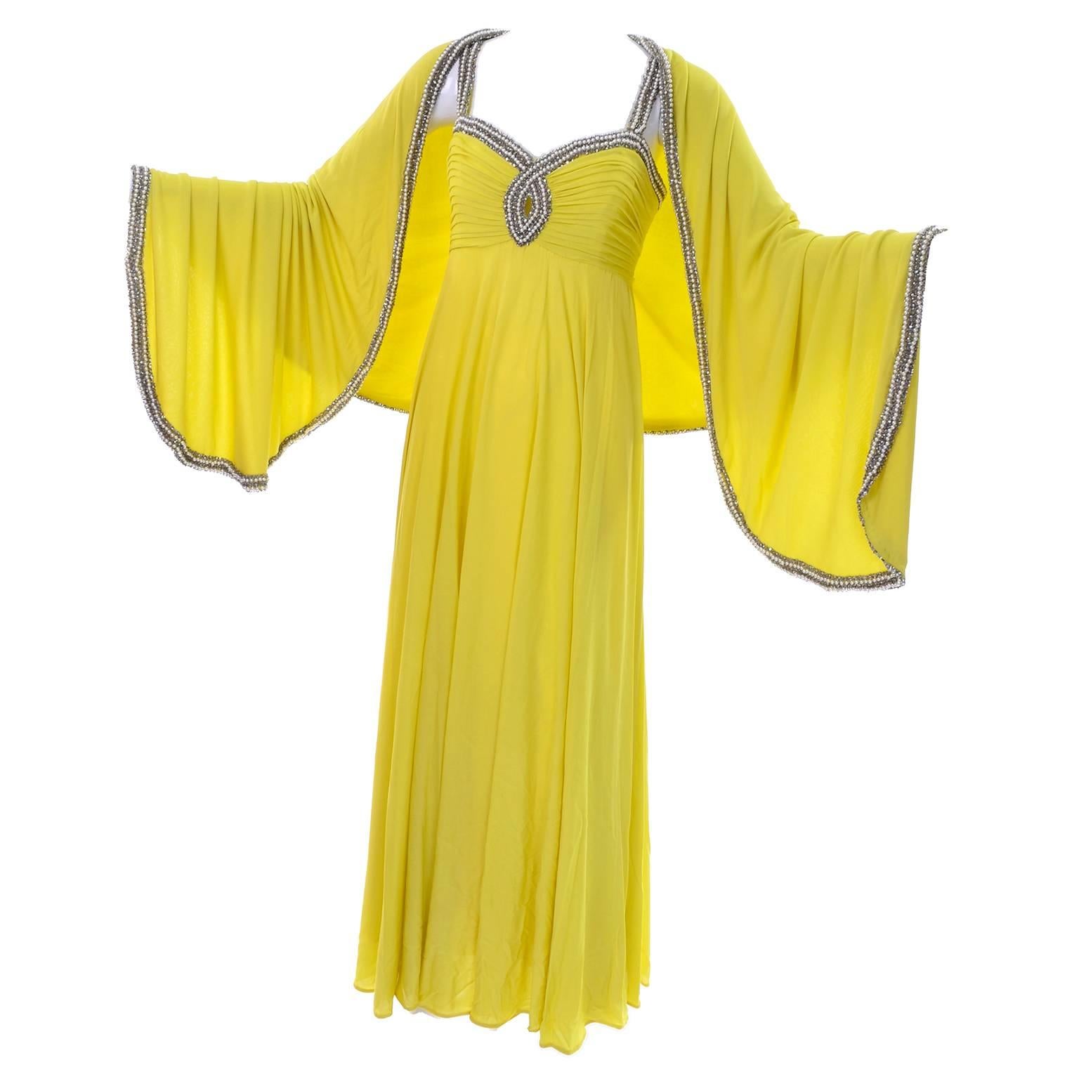 This is an exquisite chartreuse yellow - green silk chiffon vintage evening gown that comes with a matching beaded wrap. The dress was made in The British Crown Colony of Hong Kong by Seaton Enterprises Ltd. in the 1960's. There is a front keyhole