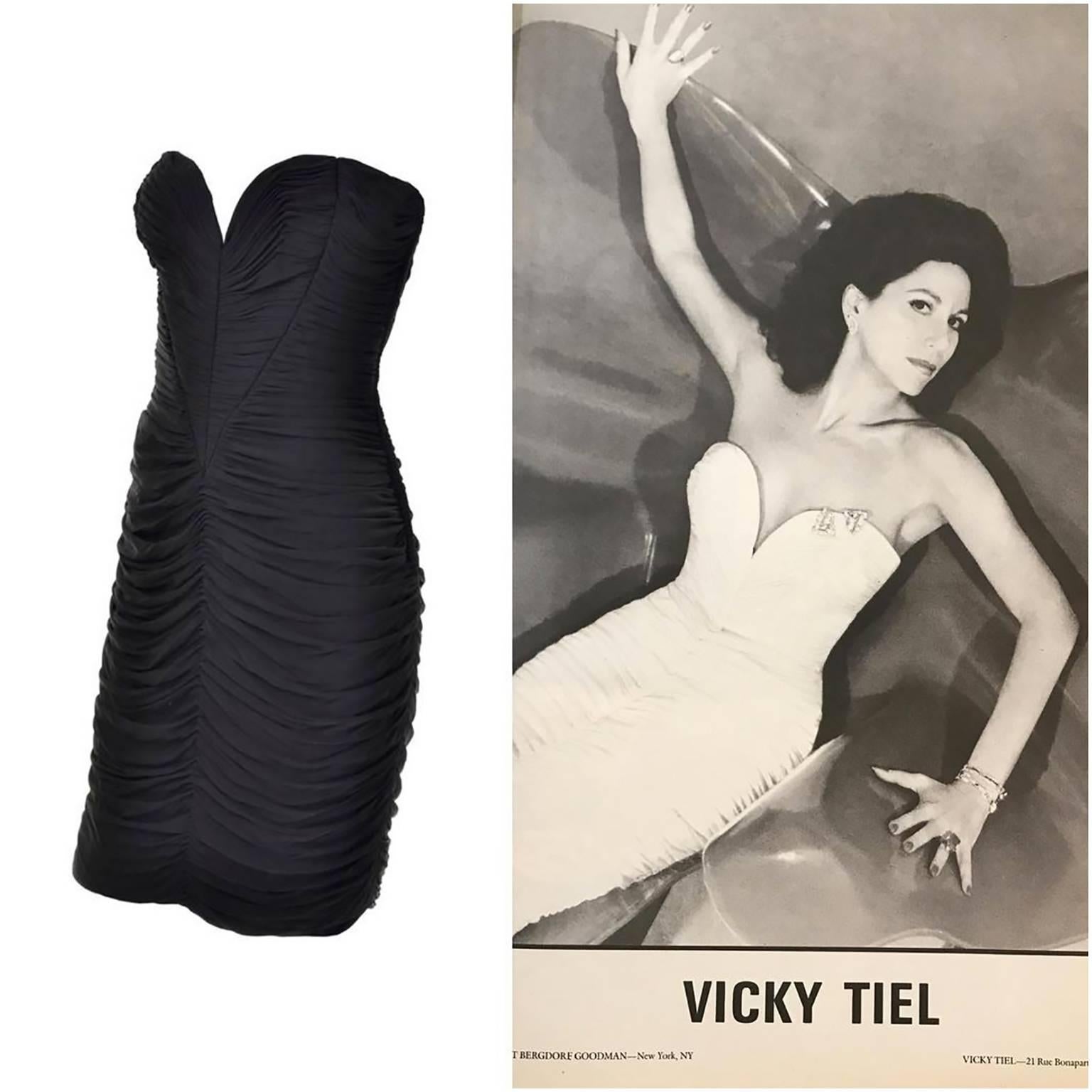 This is an outstanding vintage dress designed by Vicky Tiel in the 1980's. We are showing the full page ad of the dress in white as it appeared in Andy Warhol's magazine 
