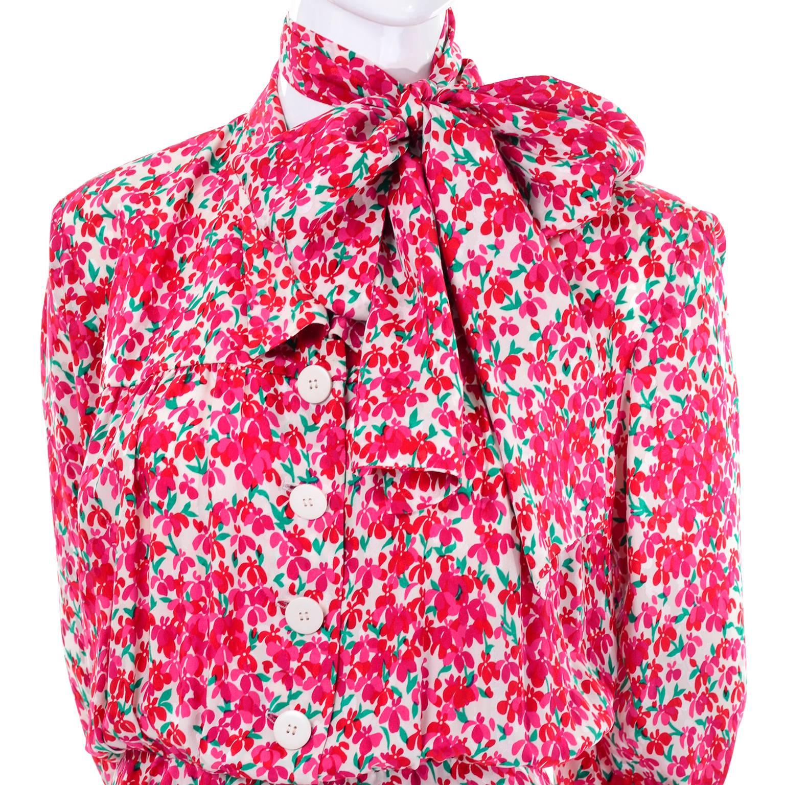 This is an Yves Saint Laurent  pretty vintage floral silk dress that buttons up the front to the waist. There is a separate matching sash that can be worn as a belt or as a scarf around the neck.  This 1970's YSL dress has long sleeves with upturned