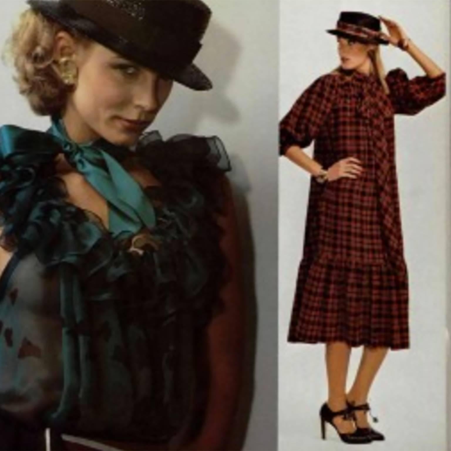 This peasant style vintage dress was designed by Yves Saint Laurent in the late 1970's. We have shown a photo from L'Officiel in 1978 with the model wearing the sash as a bow and the dress loosely. The dress is red, blue and light mustard plaid and