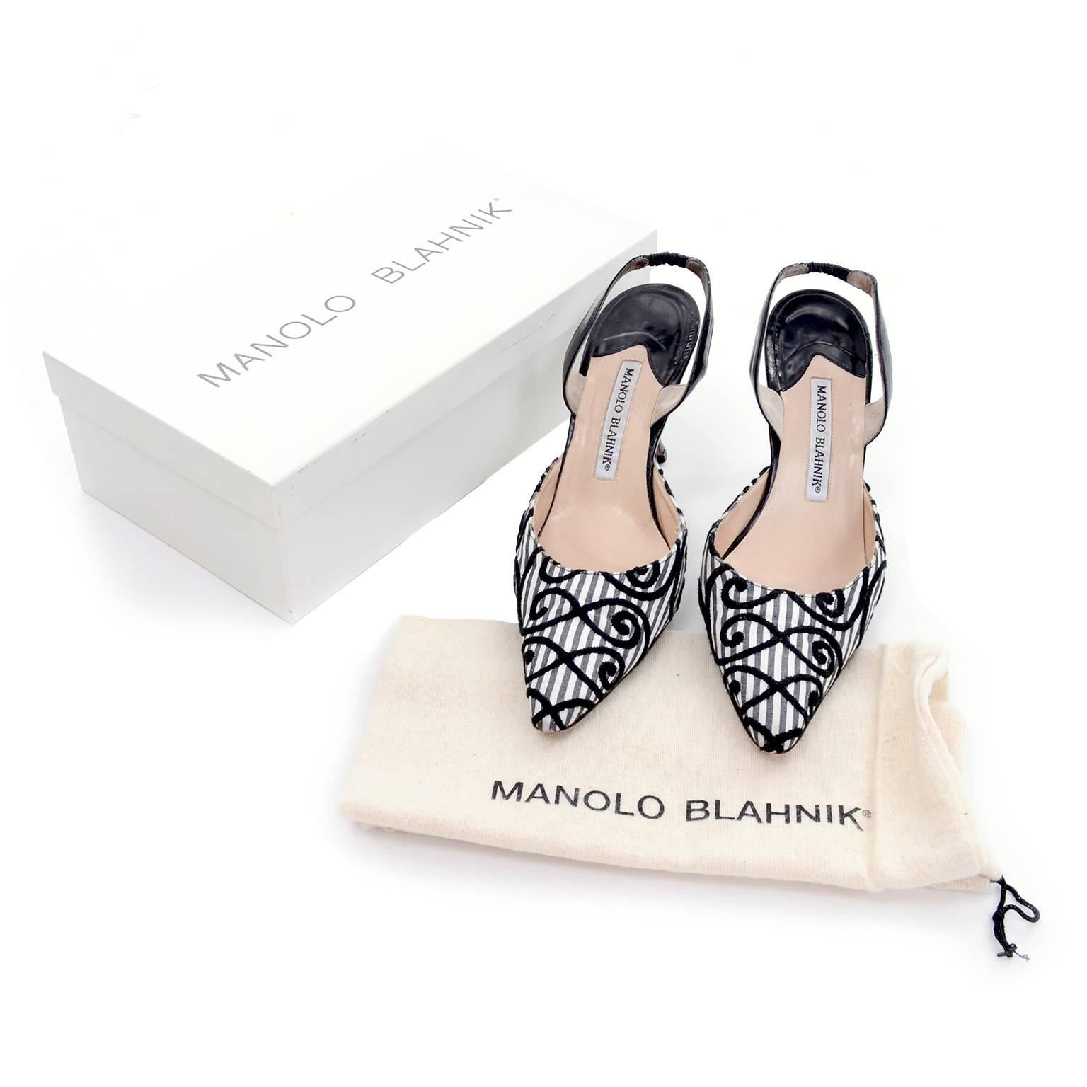 These vintage Manolo Blahnik Carolyne shoes have black velvet patterned swirls on Charcoal and white striped fabric and black leather trim. These slingback shoes are labeled a size 37.5 and have 3 and 7/8