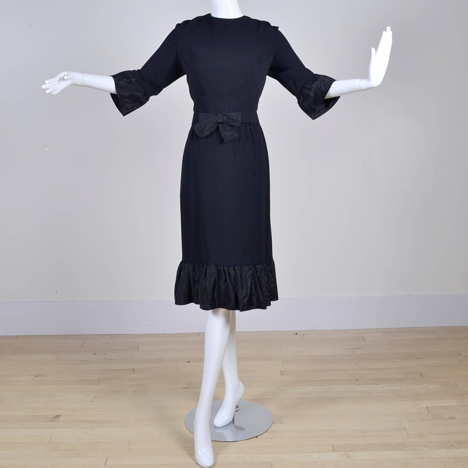 This vintage dress was designed by Jo Copeland in the late 1960's. The dress is a fine wool crepe with fabulous taffeta ruffles at the cuffs and hemline. This wonderful Pattullo-Jo Copeland dress has 3/4 length sleeves, is fully lined and comes with