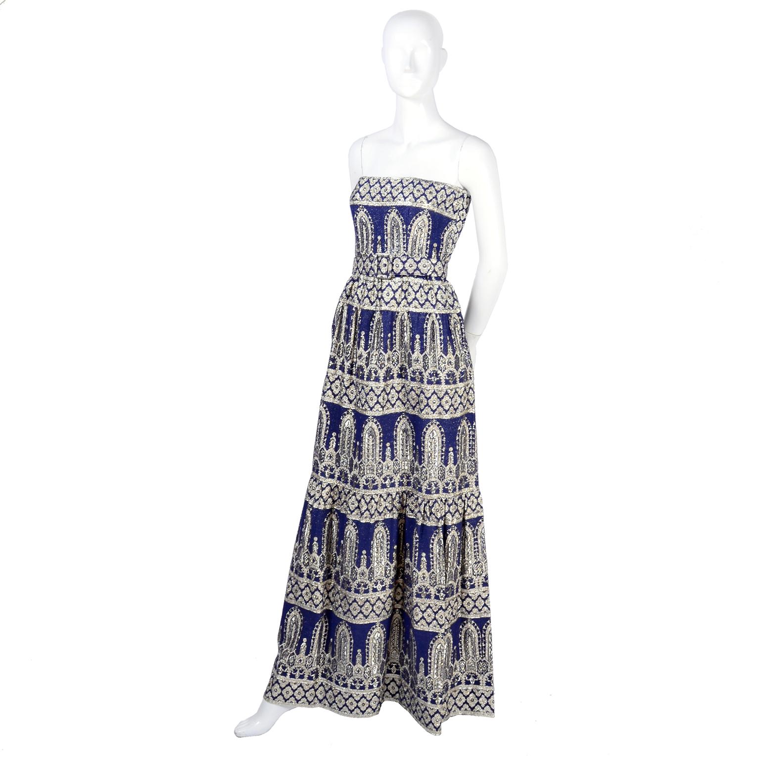 This is an absolutely gorgeous vintage Oscar de la Renta dress and jacket in blue with a metallic Byzantine pattern. This late 1960's or early 1970's 2 piece evening ensemble includes a strapless evening gown and a matching jacket.  The dress has a
