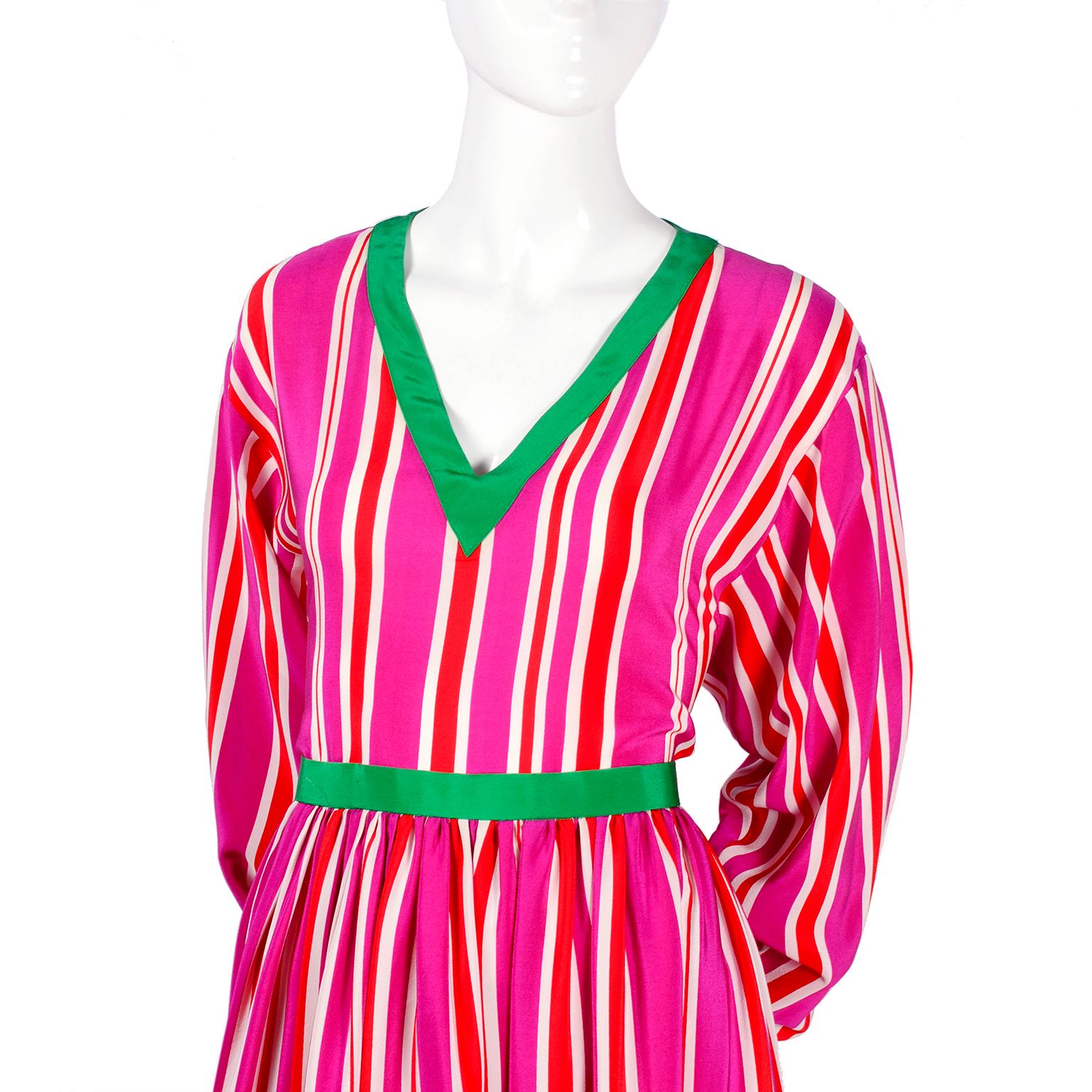 This is such a great vintage 2 piece silk dress from Oscar de la Renta.  The Miss O skirt and top ensemble is in a pink, red and white striped silk with green trim.  You can wear the V neck top with the skirt or as a separate piece.  This outfit was