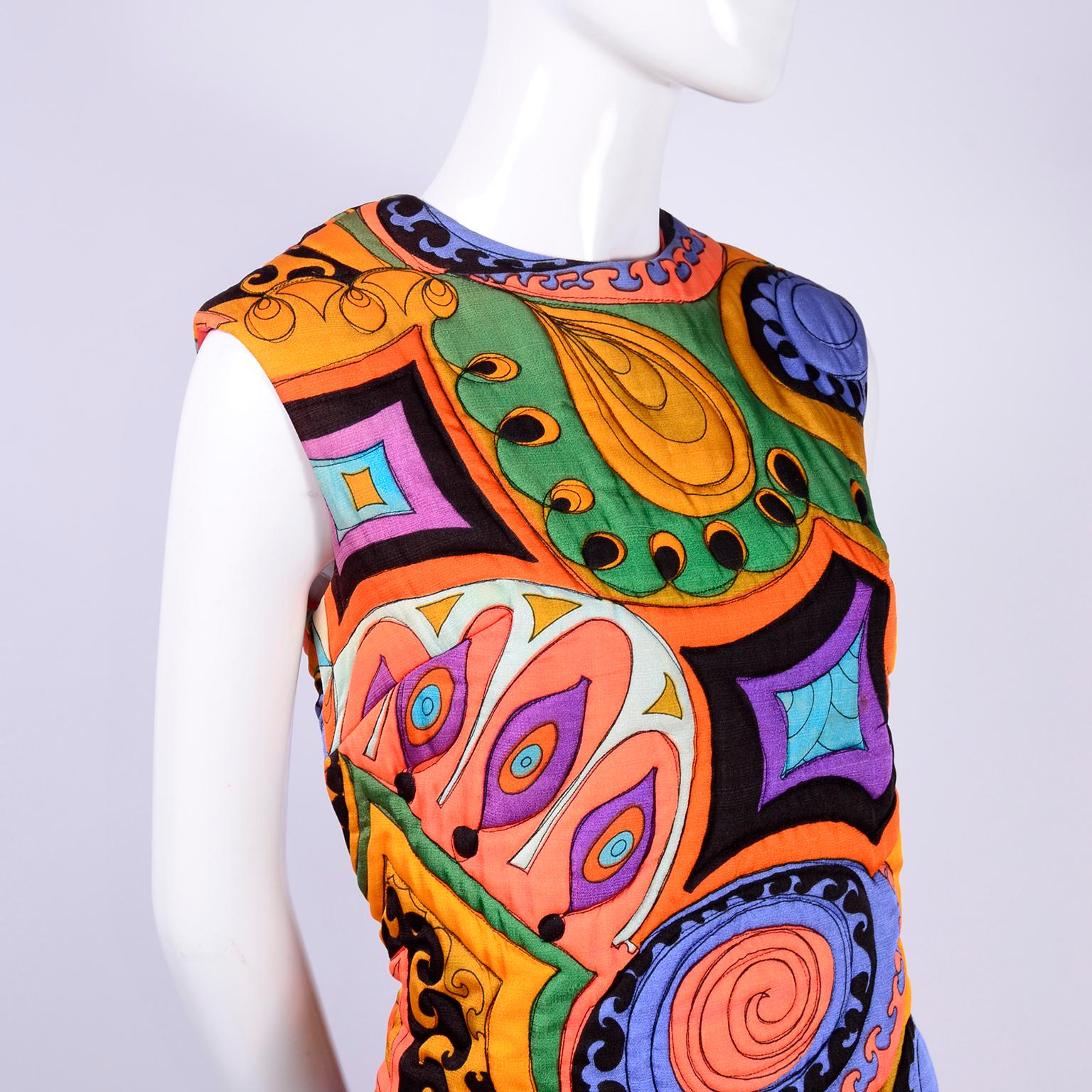 This stunning vintage Dynasty dress was made in Hong Kong in the late 1960's.  The dress is sleeveless and was meant to be worn over trousers or slacks and you can pair it with any pair of slim black pants or loose silk pajama style pants.  The long