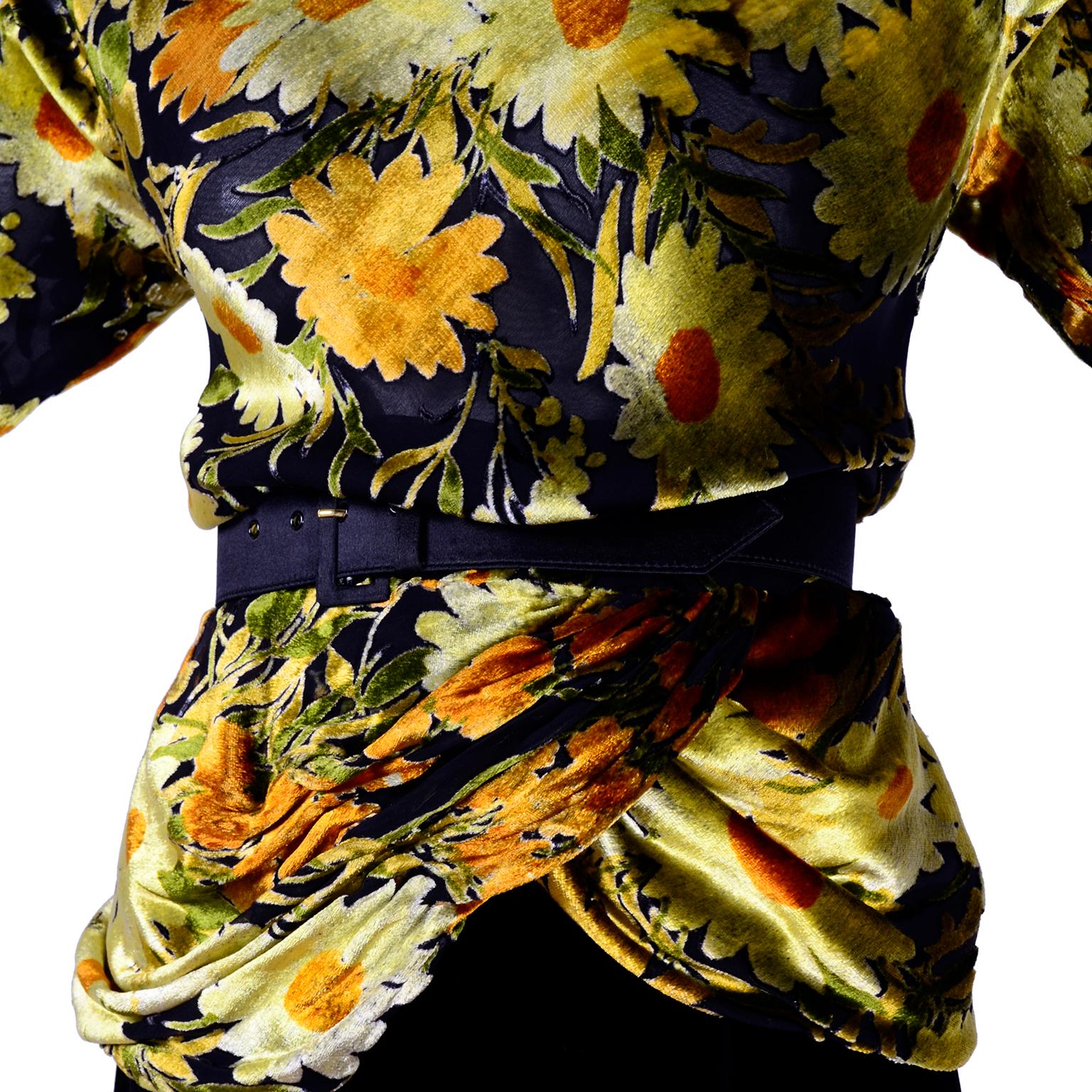 This beautiful 3 piece vintage dress from Valentino includes a burn out velvet top in a yellow, green, orange and black floral print and a slim black velvet skirt.  The semi sheer faux turtleneck long sleeved top is lined in a fine black silk,