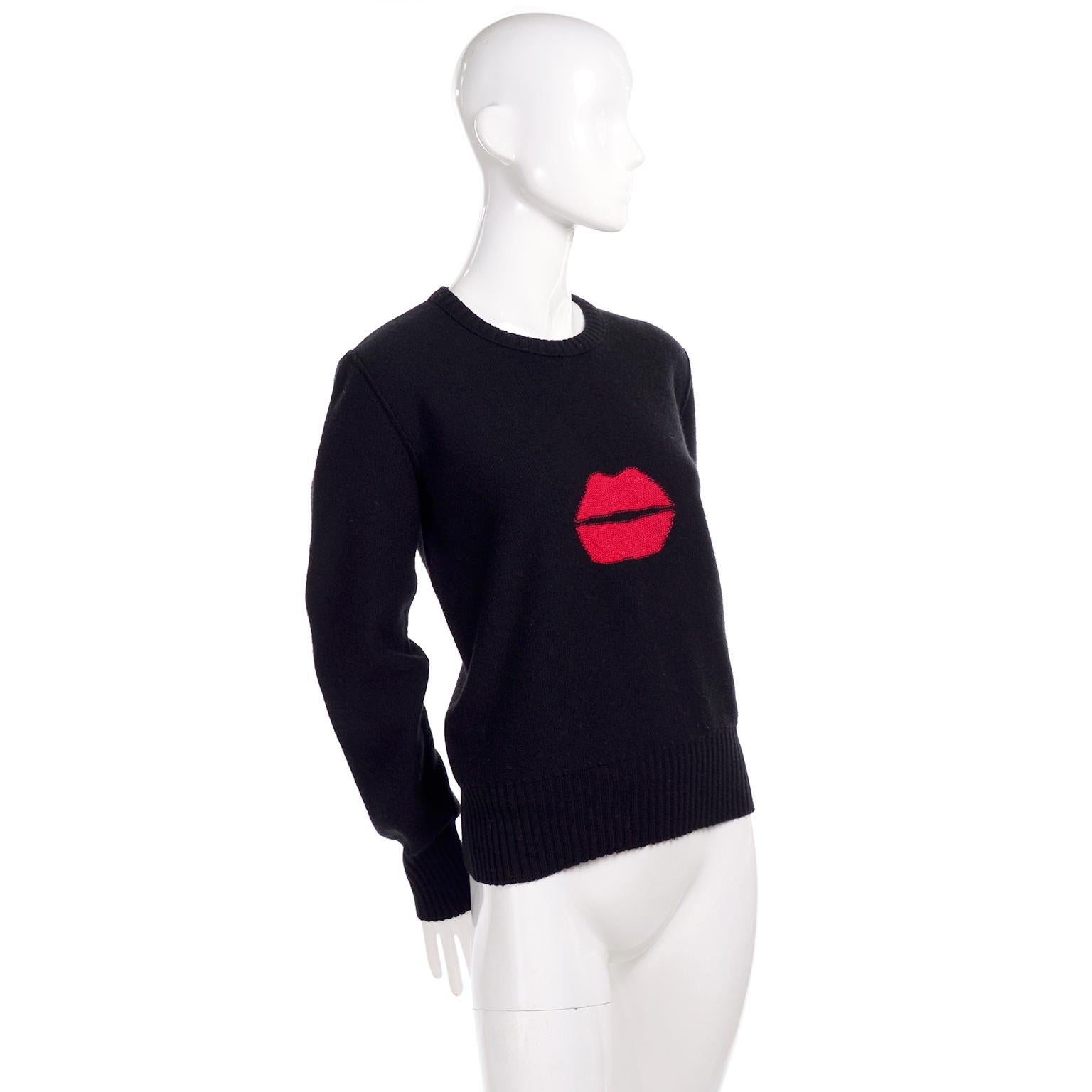 This is an iconic vintage sweater from designer Sonia Rykiel.  This great vintage black sweater is called the kiss sweater and is in a blend of 85% wool and 15% angora. There are red lips on the front center and the sweater is from the 1980's.  All